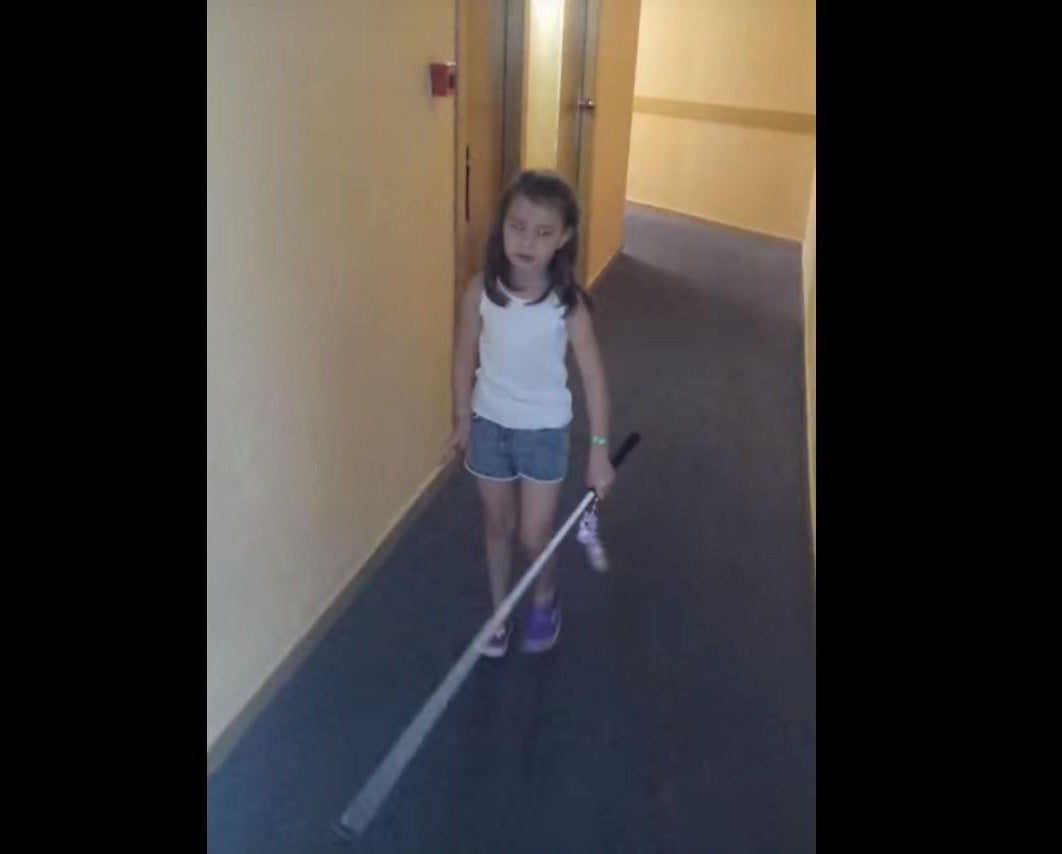 Lily-Grace using her cane in a video shot by her mother Kirsty