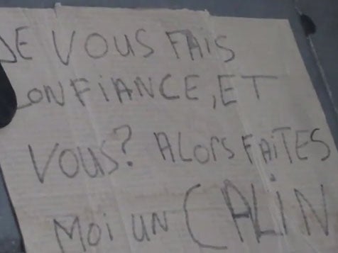 The man stood next to a sign reading: “I’m Muslim, but I’m told that I’m a terrorist. I trust you, do you trust me?" YouTube