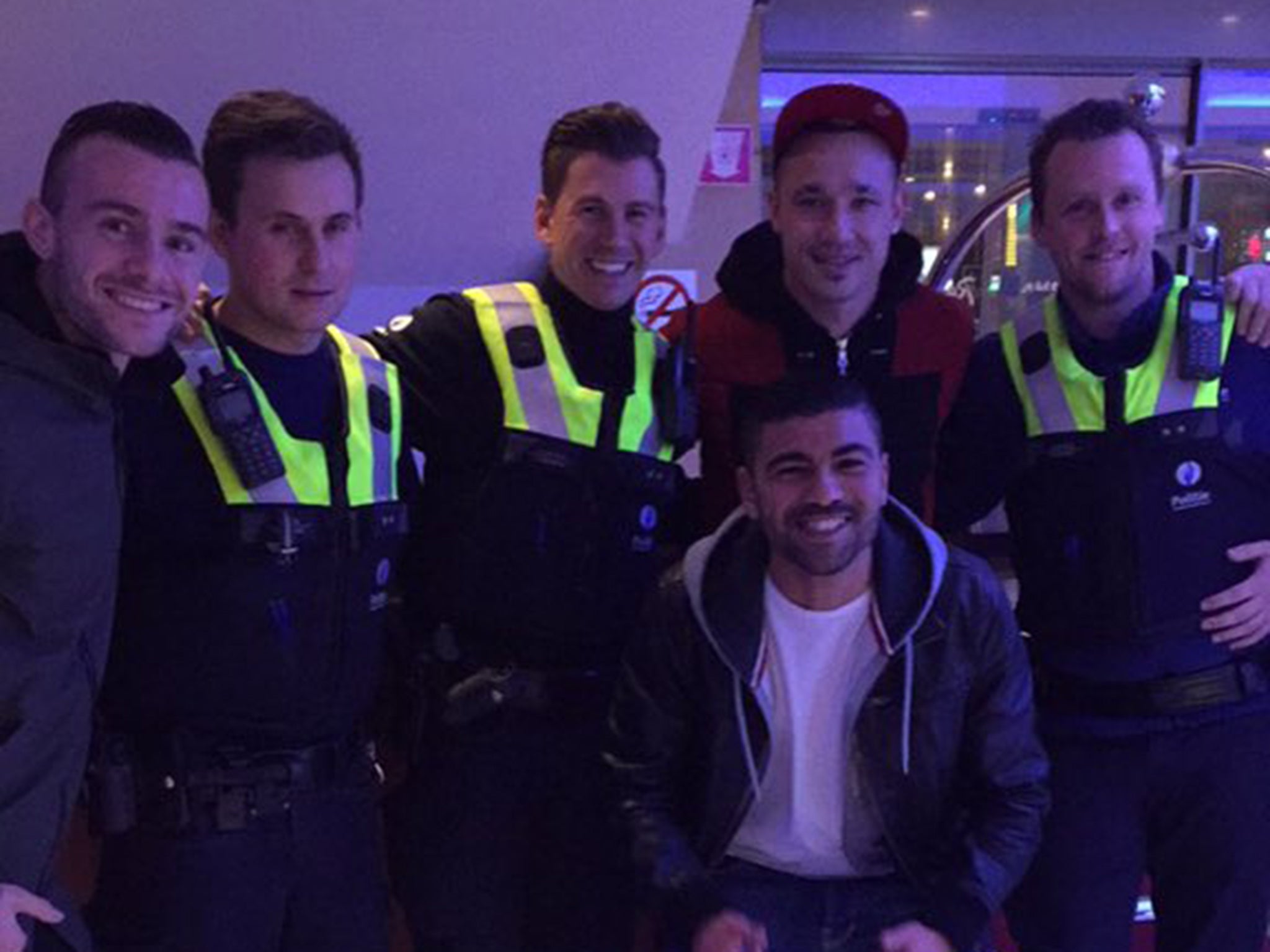 Radja Nainggolan and friends pose with police