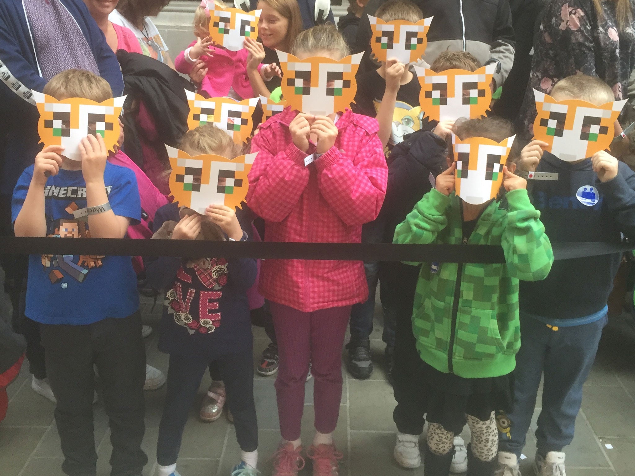 Young fans wearing masks wait to meet Garrett