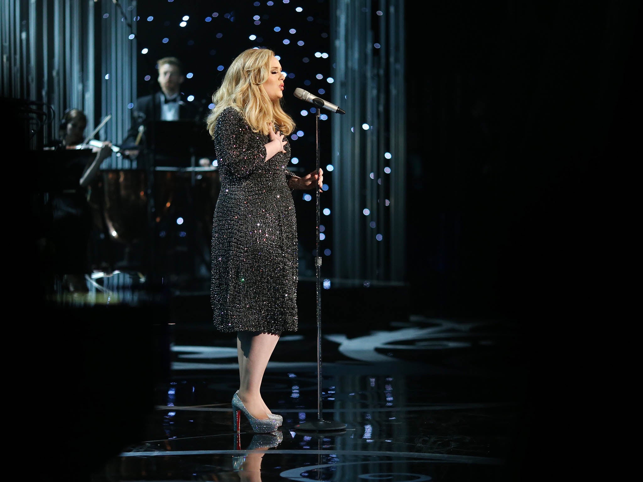 Adele performs onstage during the Oscars held at the Dolby Theatre