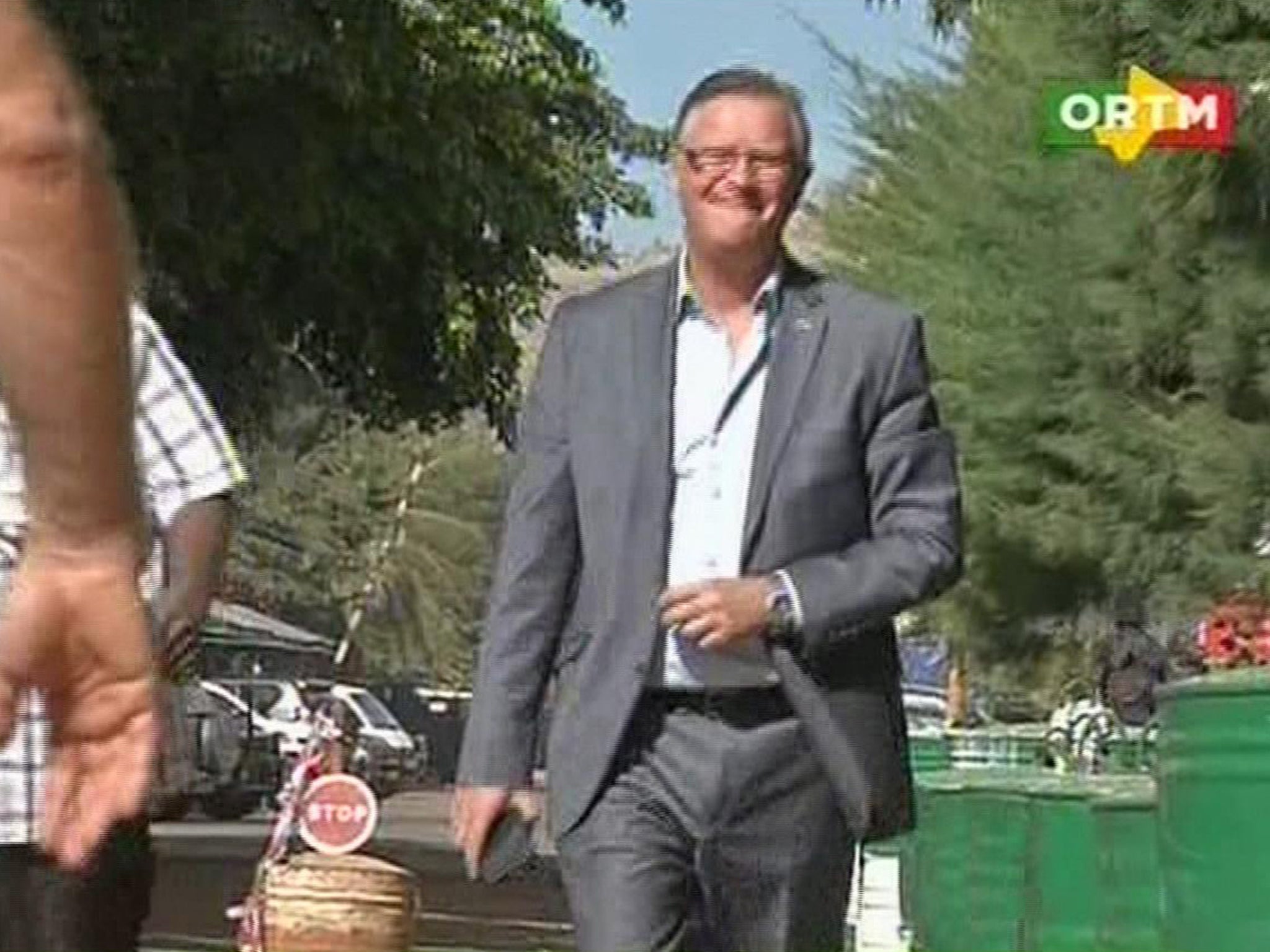 An unidentified man who was in the Radisson Blu Hotel walks to safety in Bamako