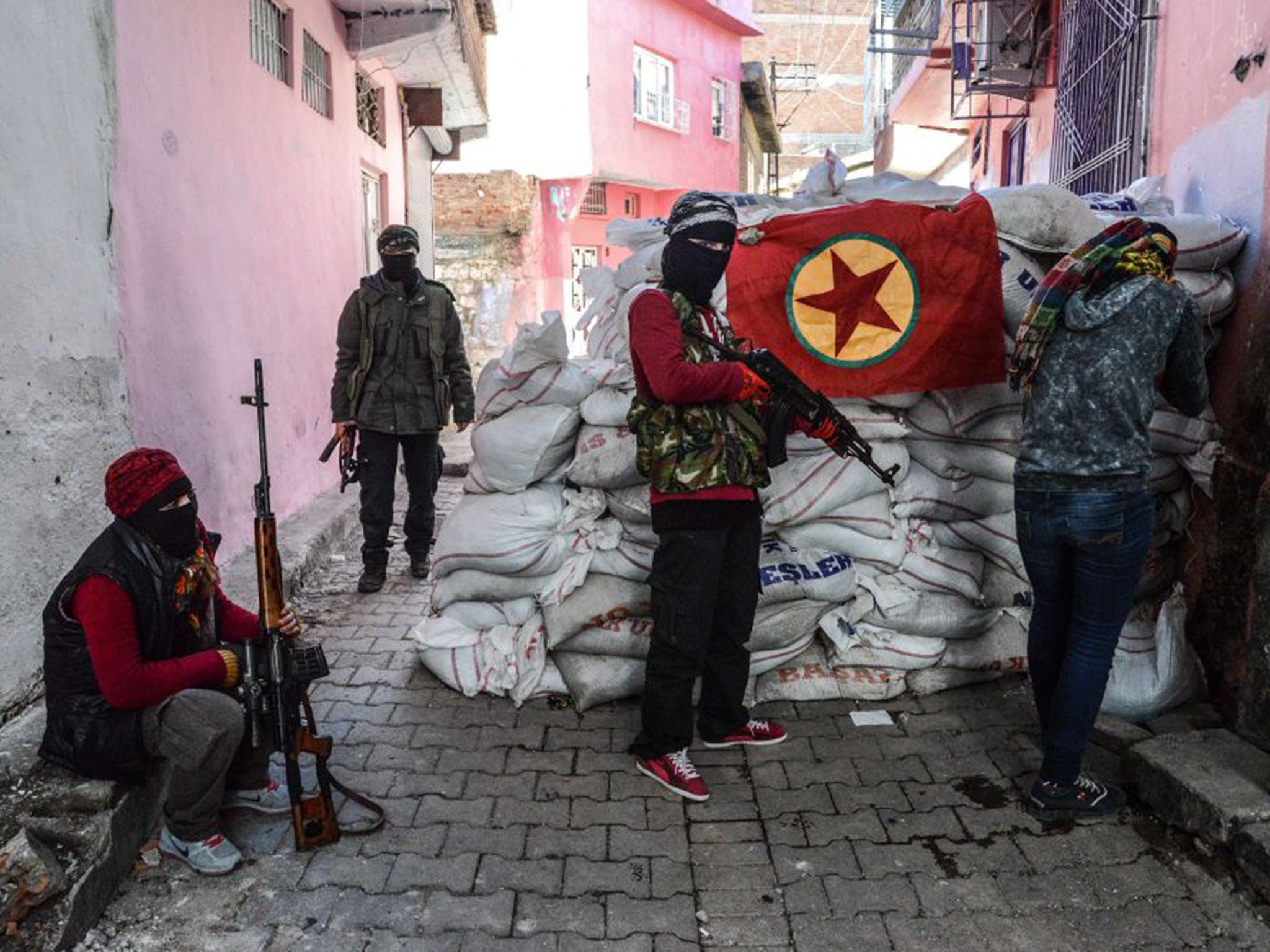 Armed PKK members man a barricade in the Sur district of Diyarbakir