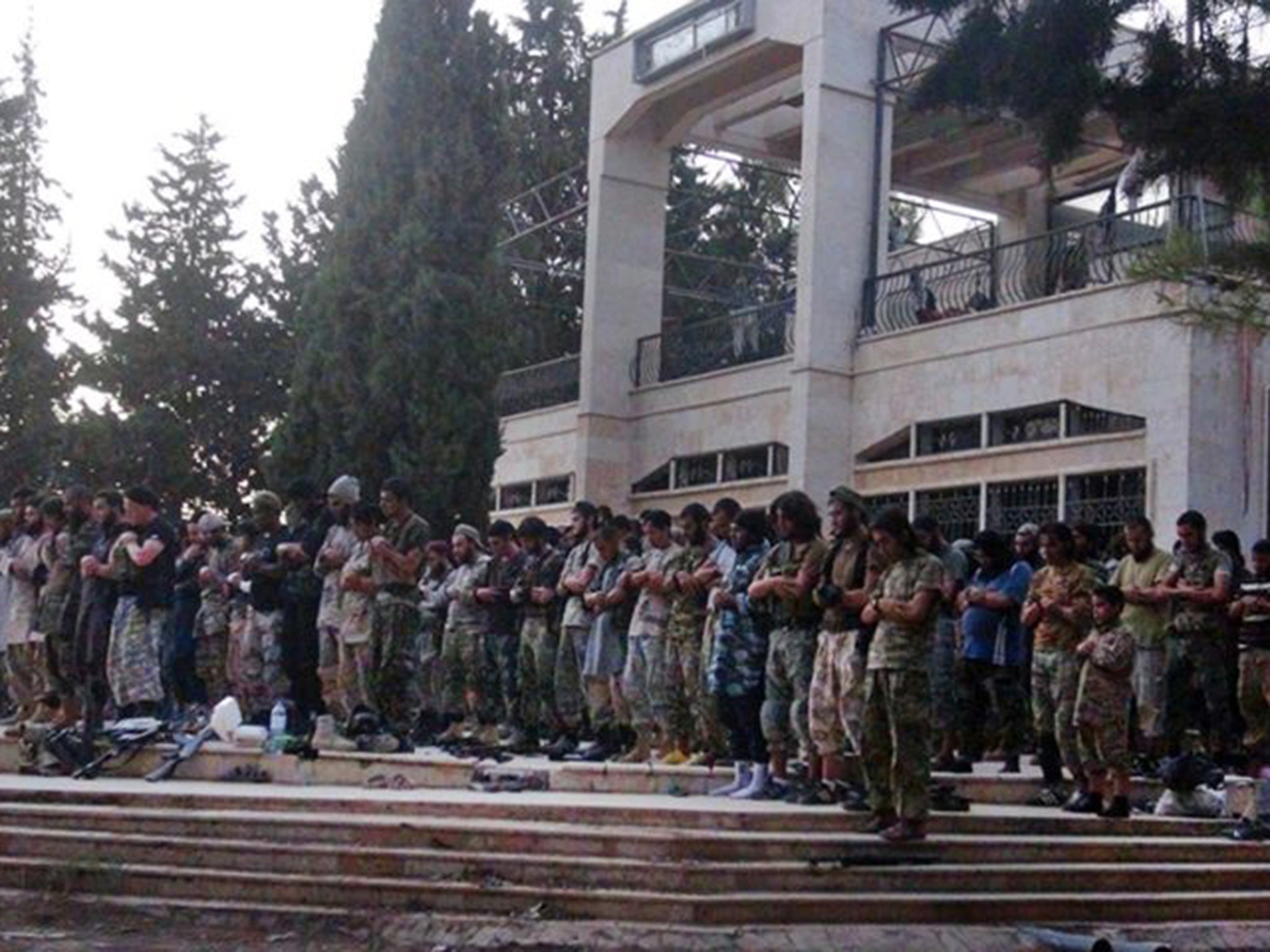 Isis fighters at the Tabqa airbase in Raqqa province after capturing it from the Syrian government in 2014