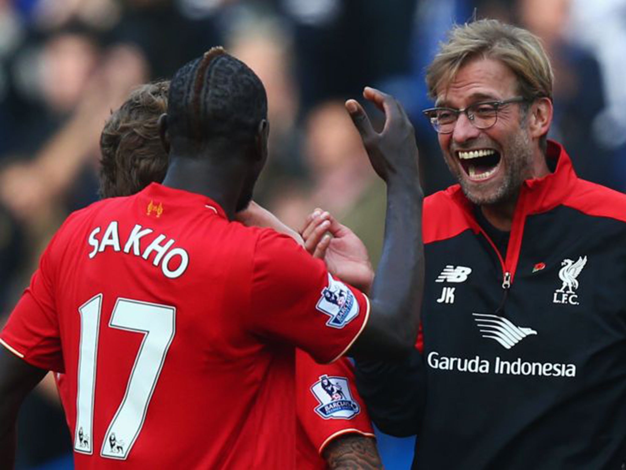 Jurgen Klopp celebrates his team's 3-1 win over Chelsea with Mamadou Sakho