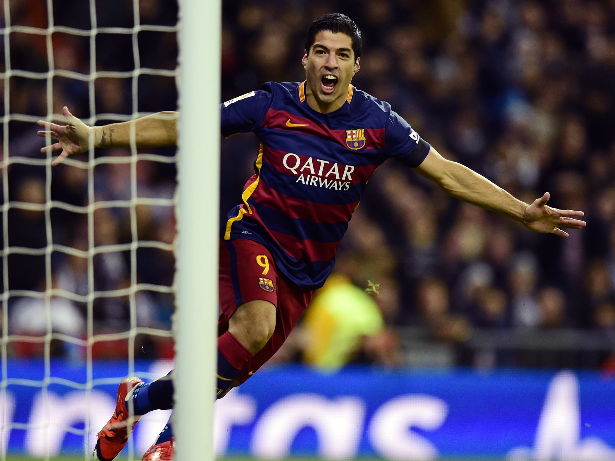 Luis Suarez celebrates opening the scoring