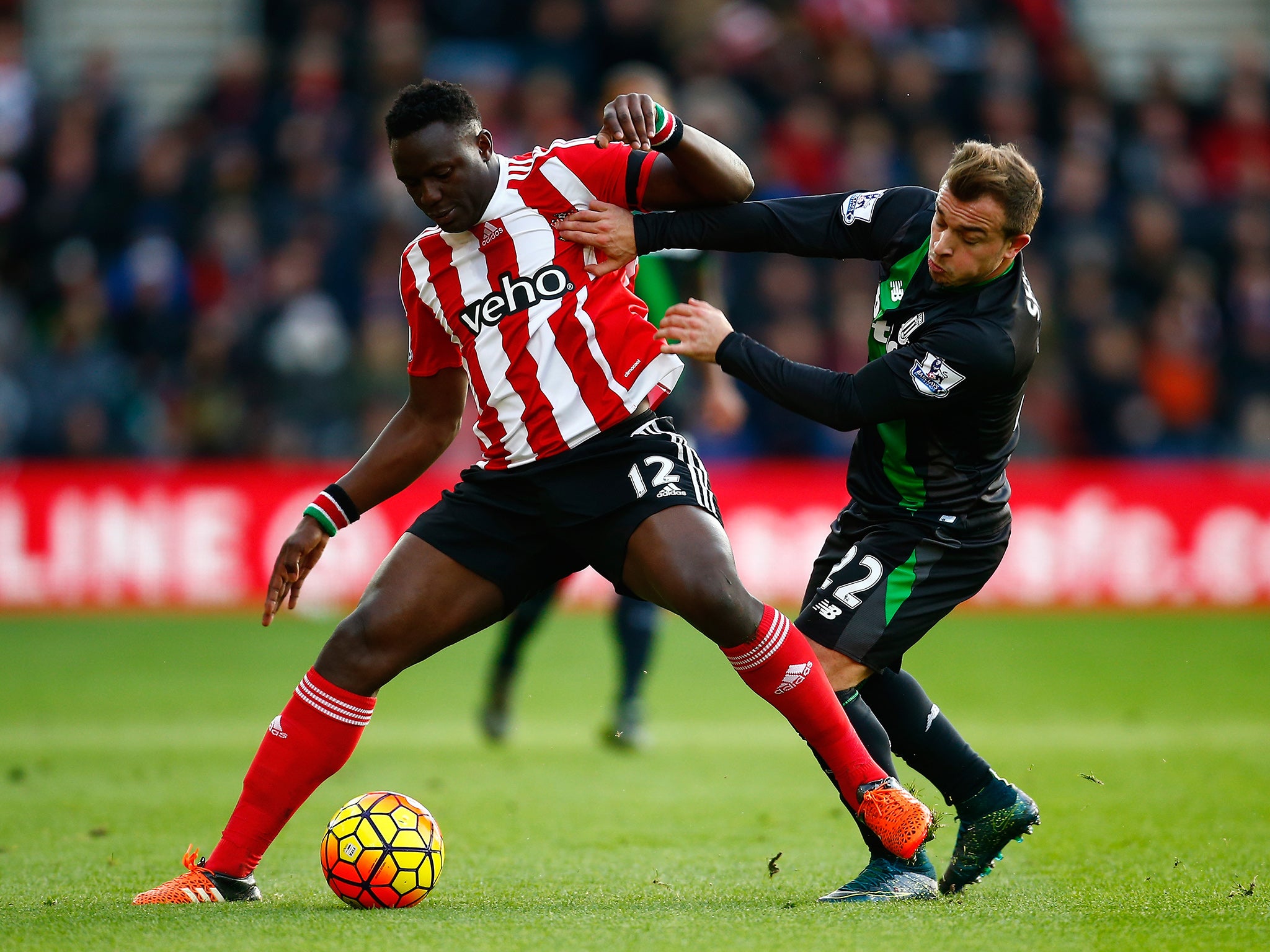 Victor Wanyama and Xherdan Shaqiri tussle for the ball