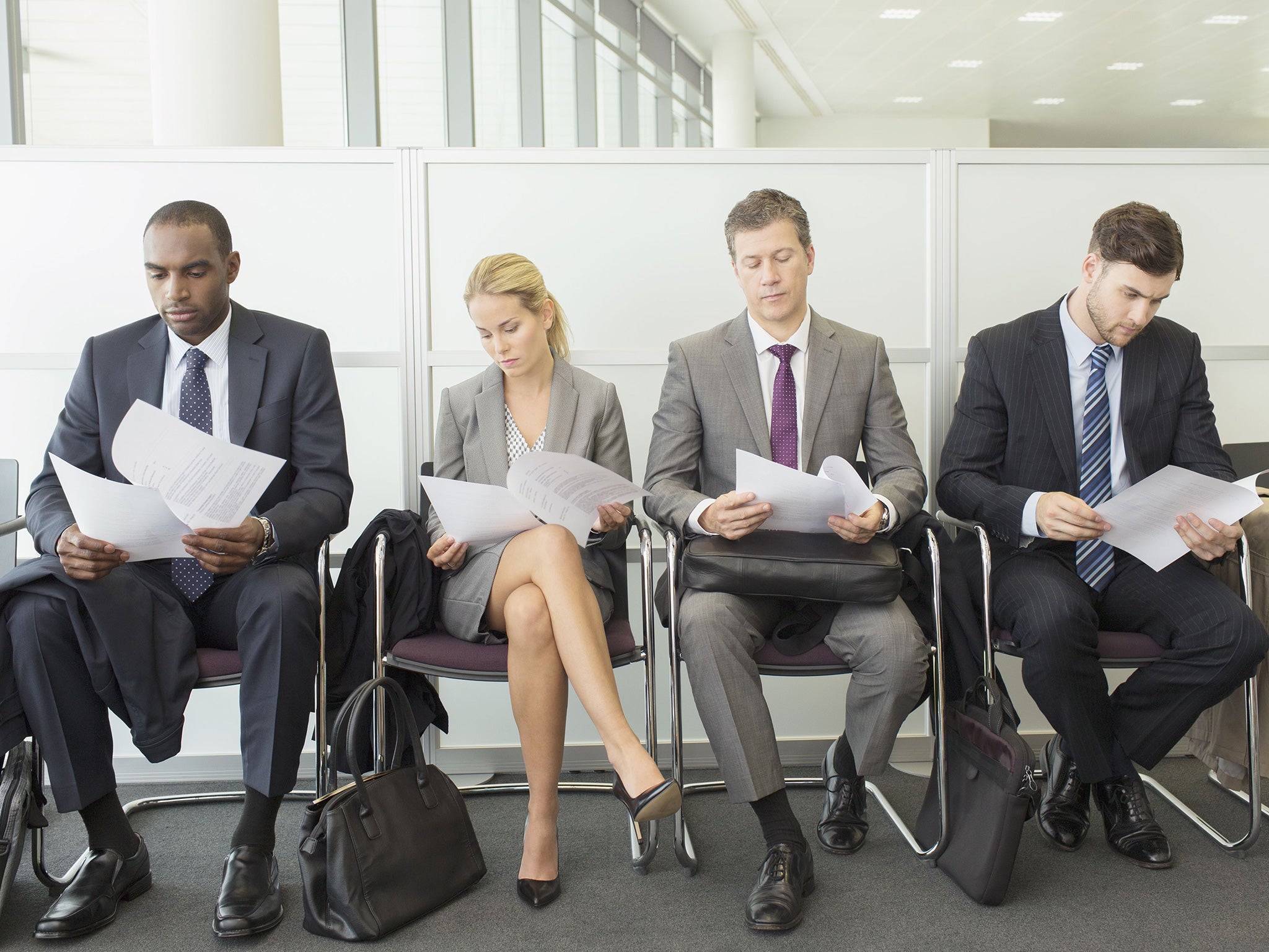 Candidates line up for a job interview