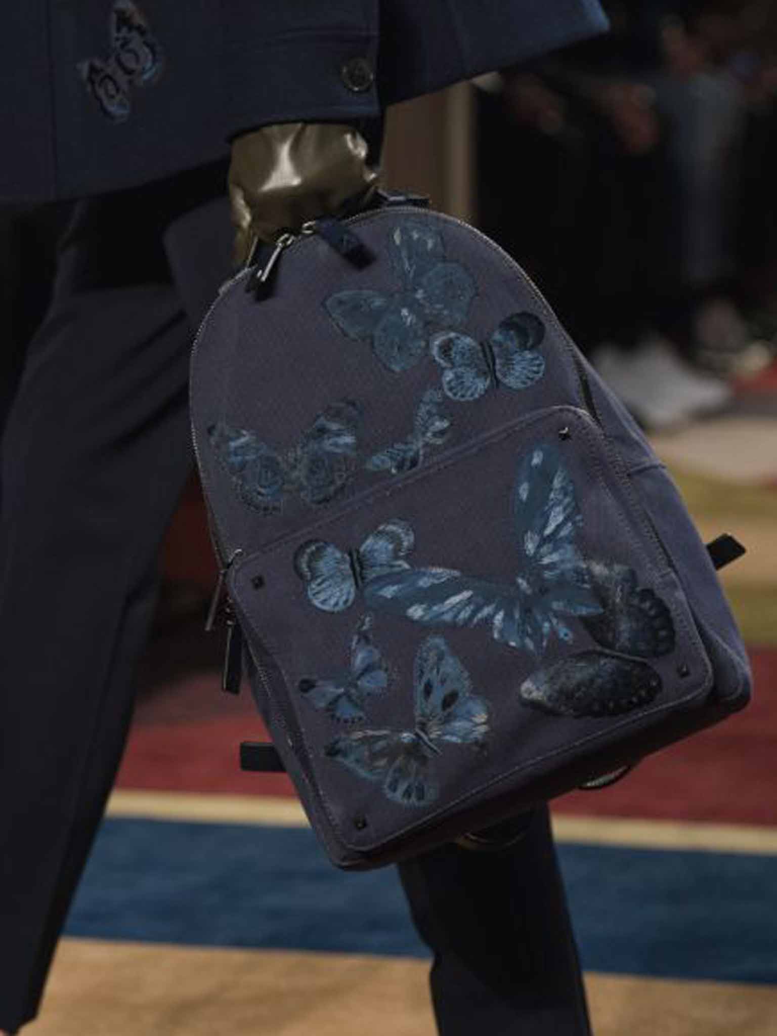 An embroidered Valentino man-bag