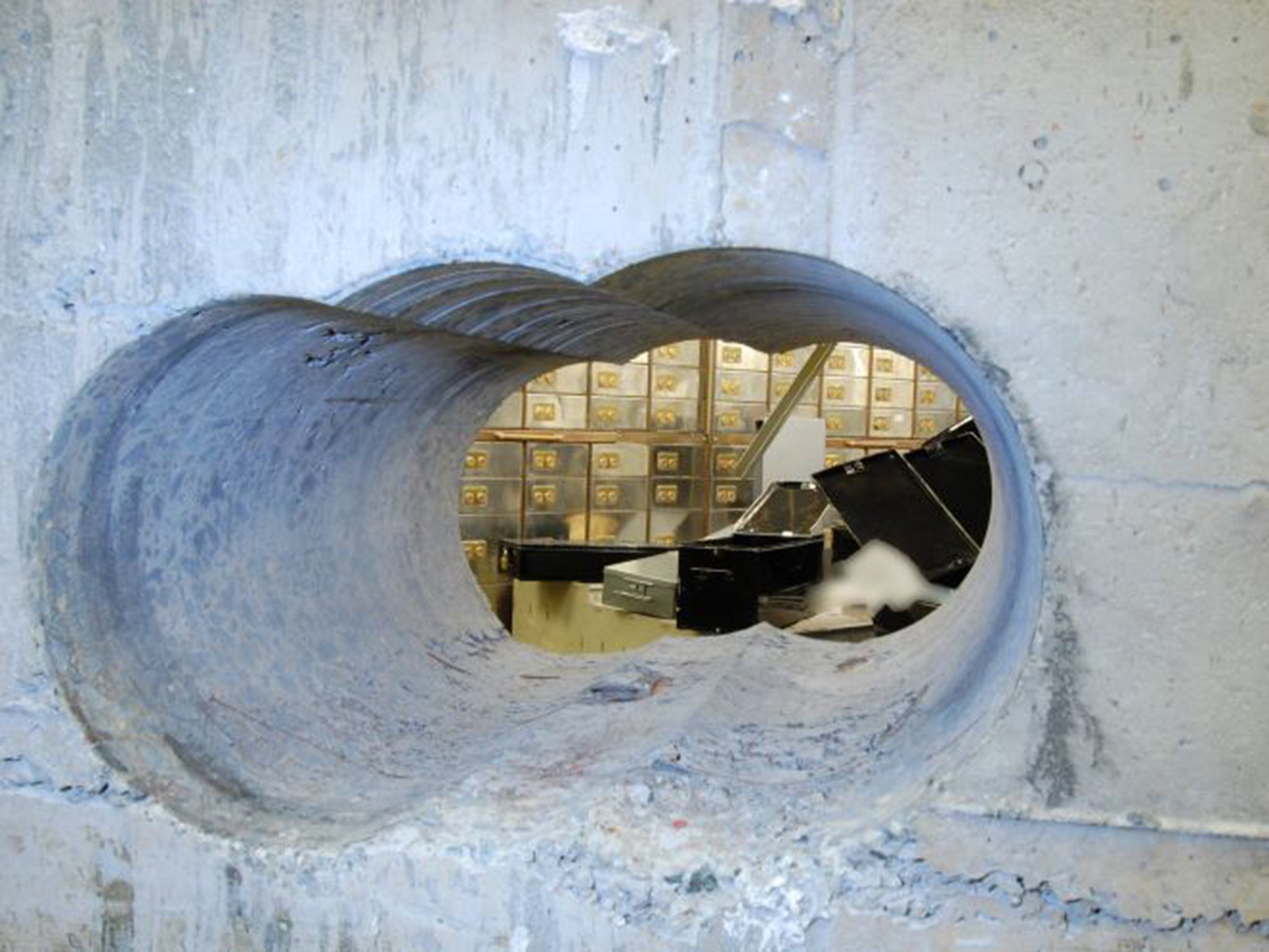 A police shot of the hole drilled into the vault at Hatton Garden Safe Deposit during the Easter raid