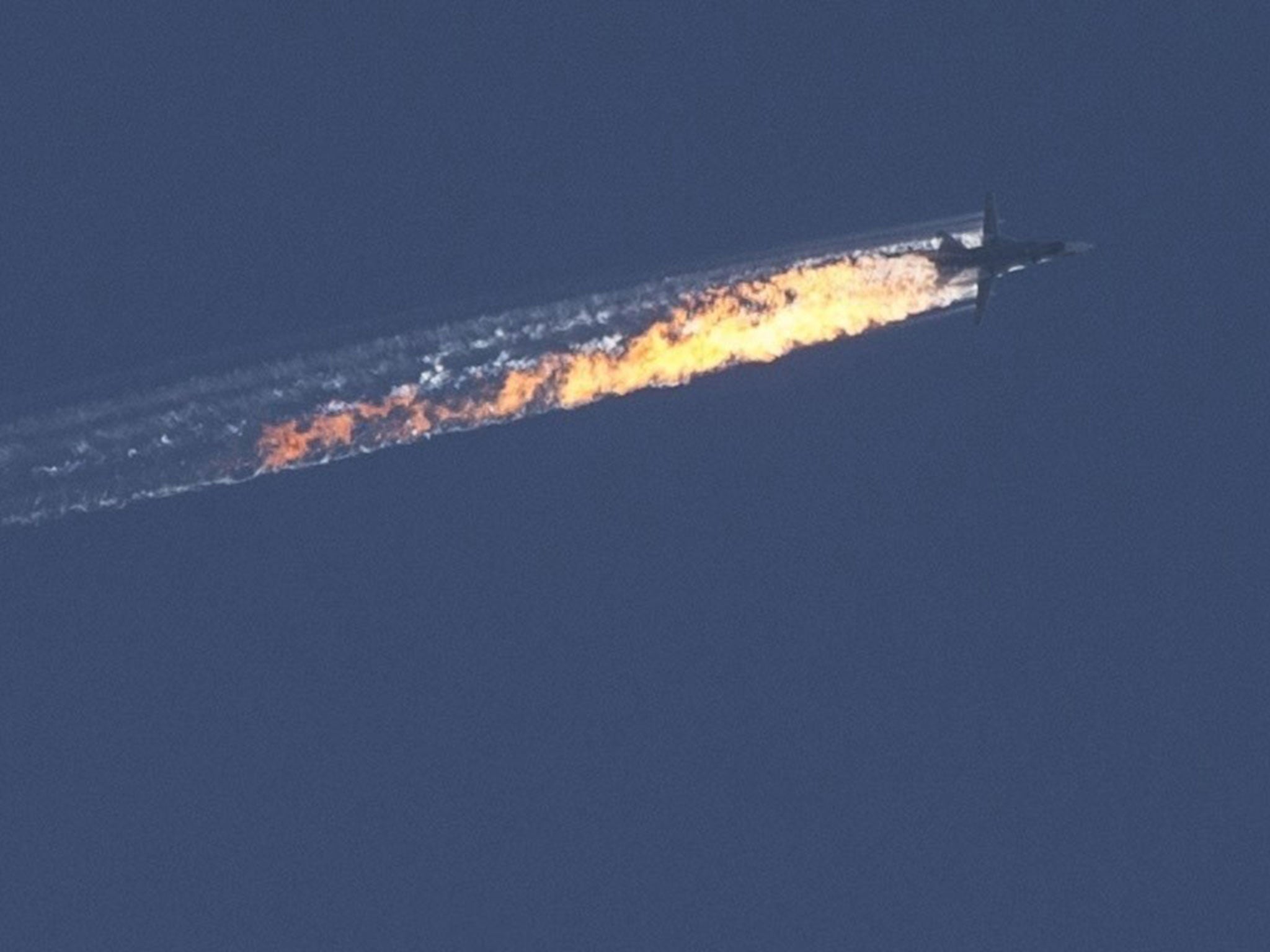 A trail of flames is seen behind the jet after it was struck by the Turkish military