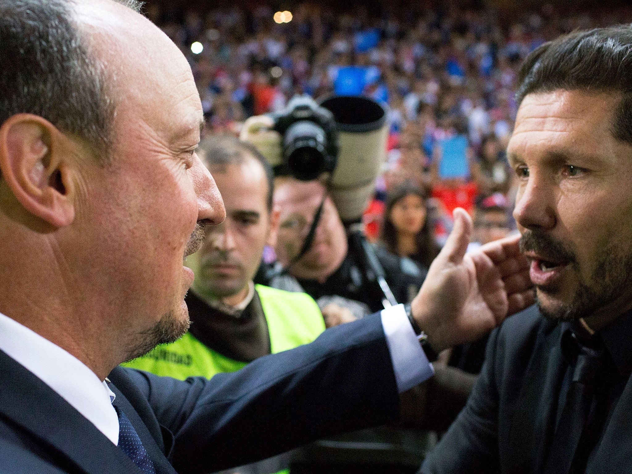 Real Madrid manager Rafa Benitez (left) and Atletico Madrid's Diego Simeone