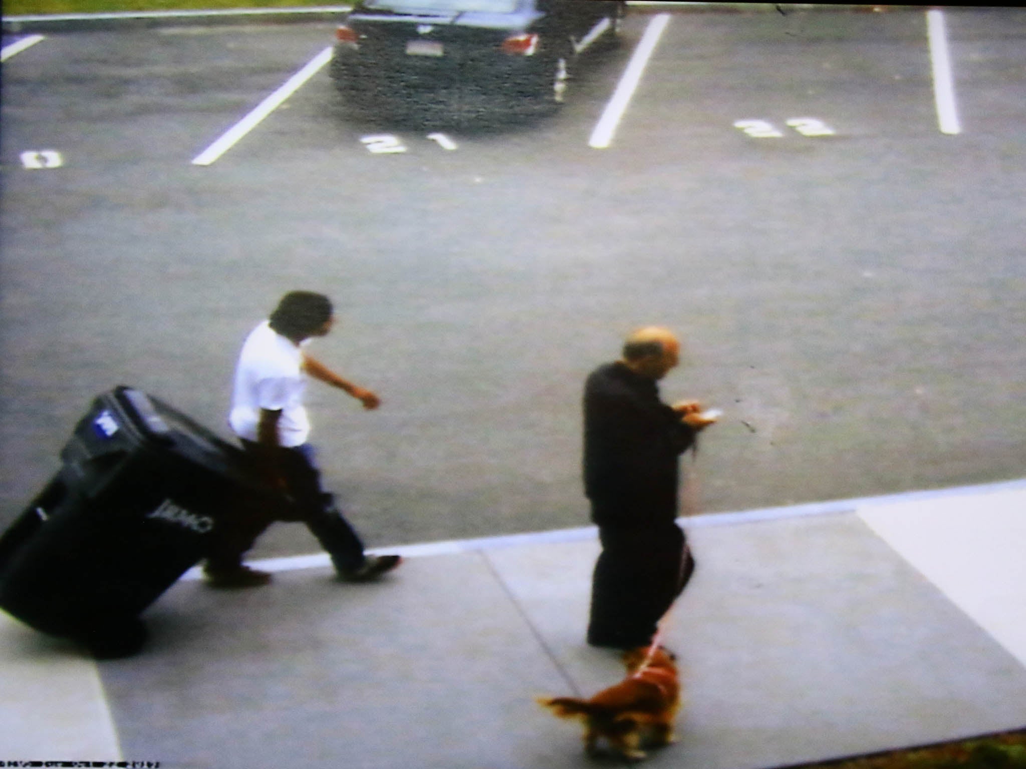 &#13;
Philip Chism shown wheeling a large recycling bin outside Danvers High School&#13;