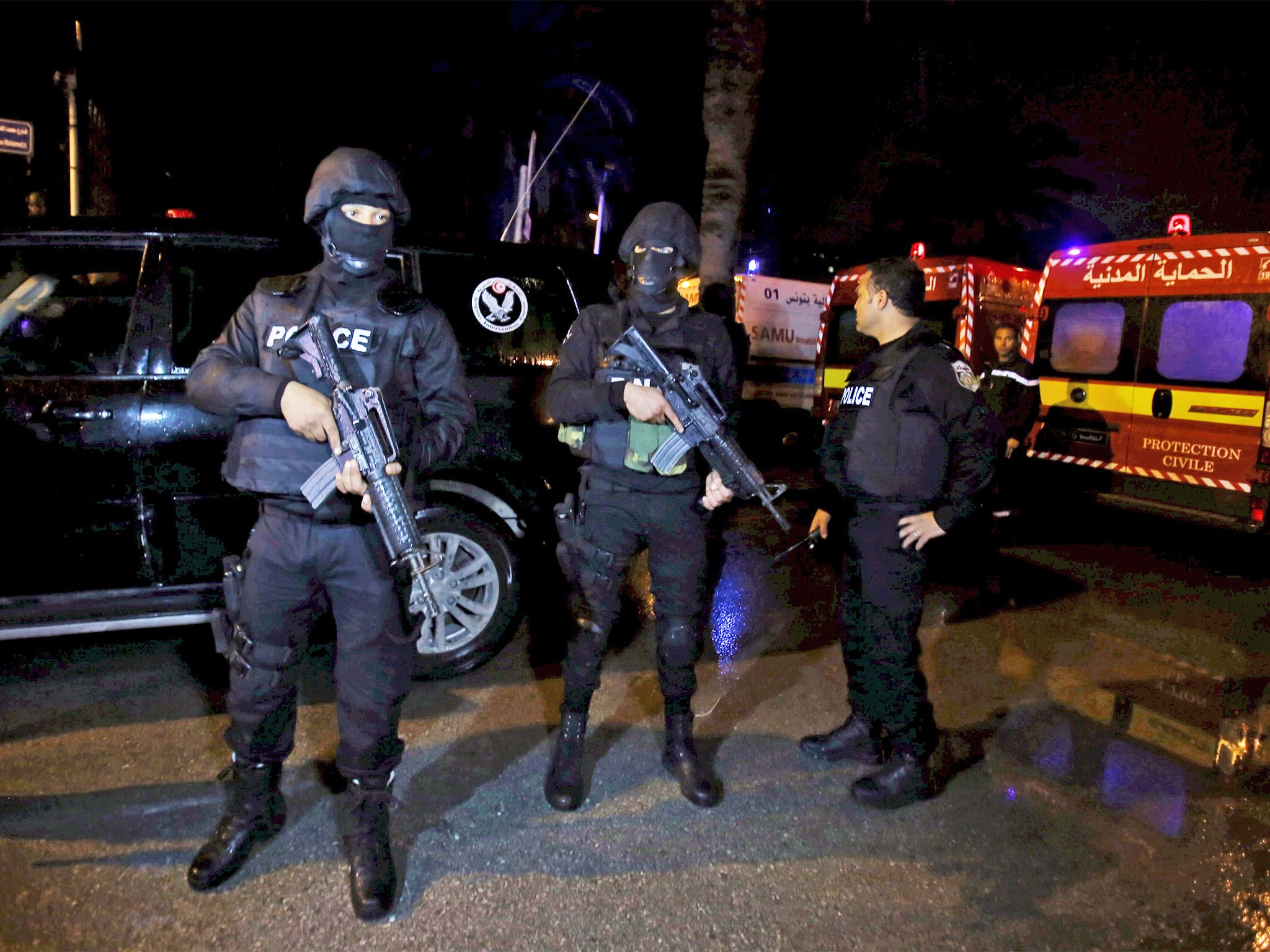 Armed Tunisian police officers on guard following the attack in Tunis