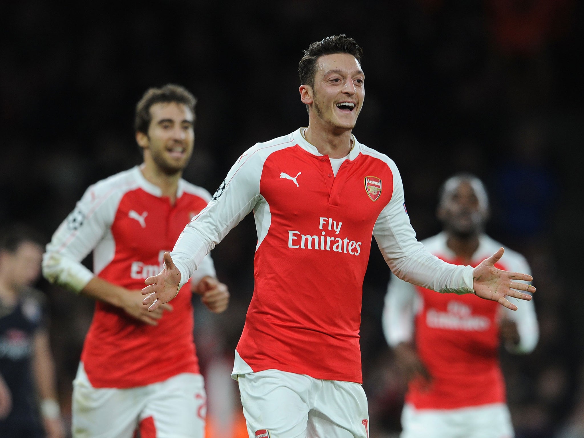 Mesut Ozil celebrates his opening goal