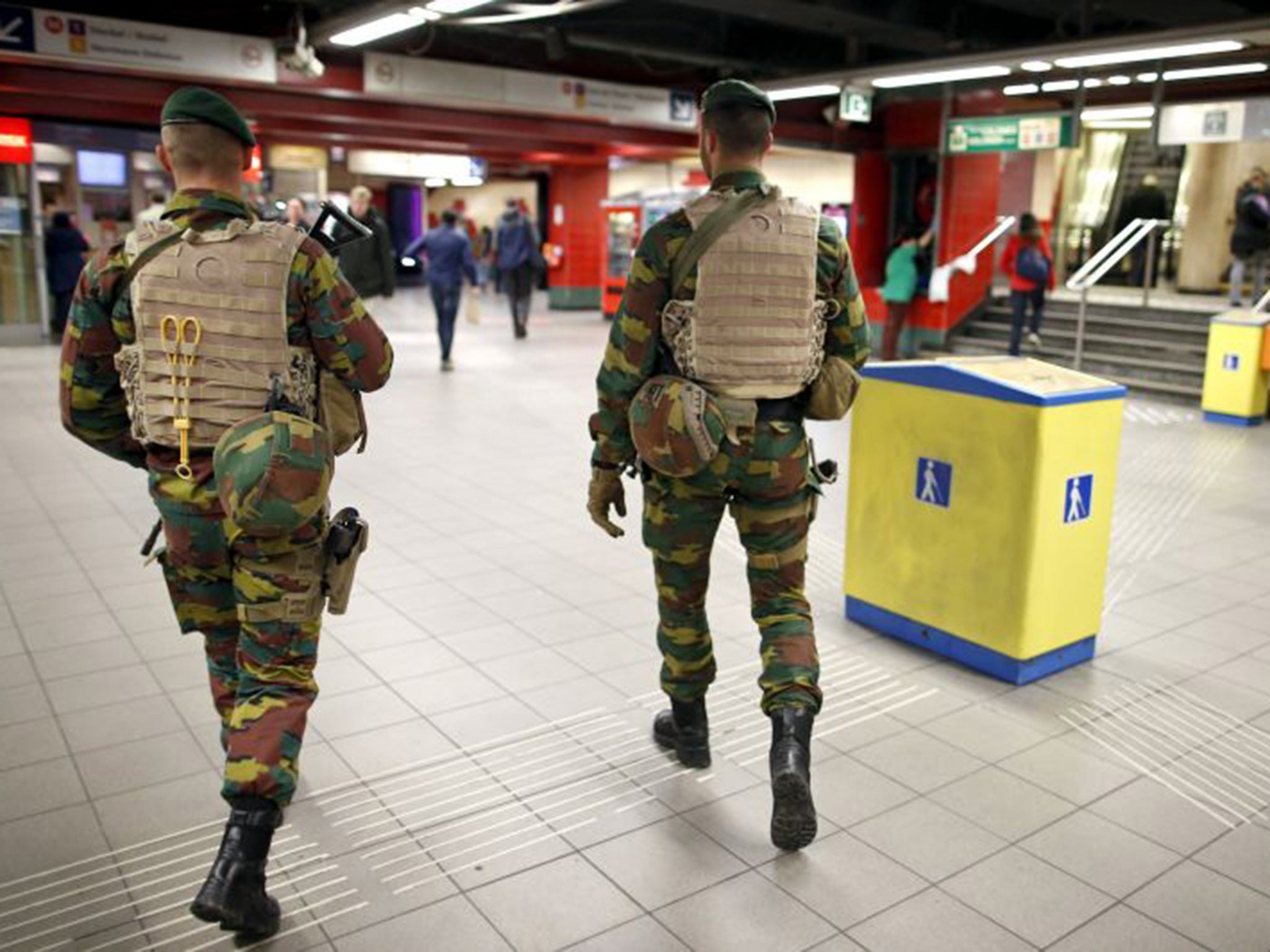 Belgian soldiers patrol at the Central Station subway stop in Brussels