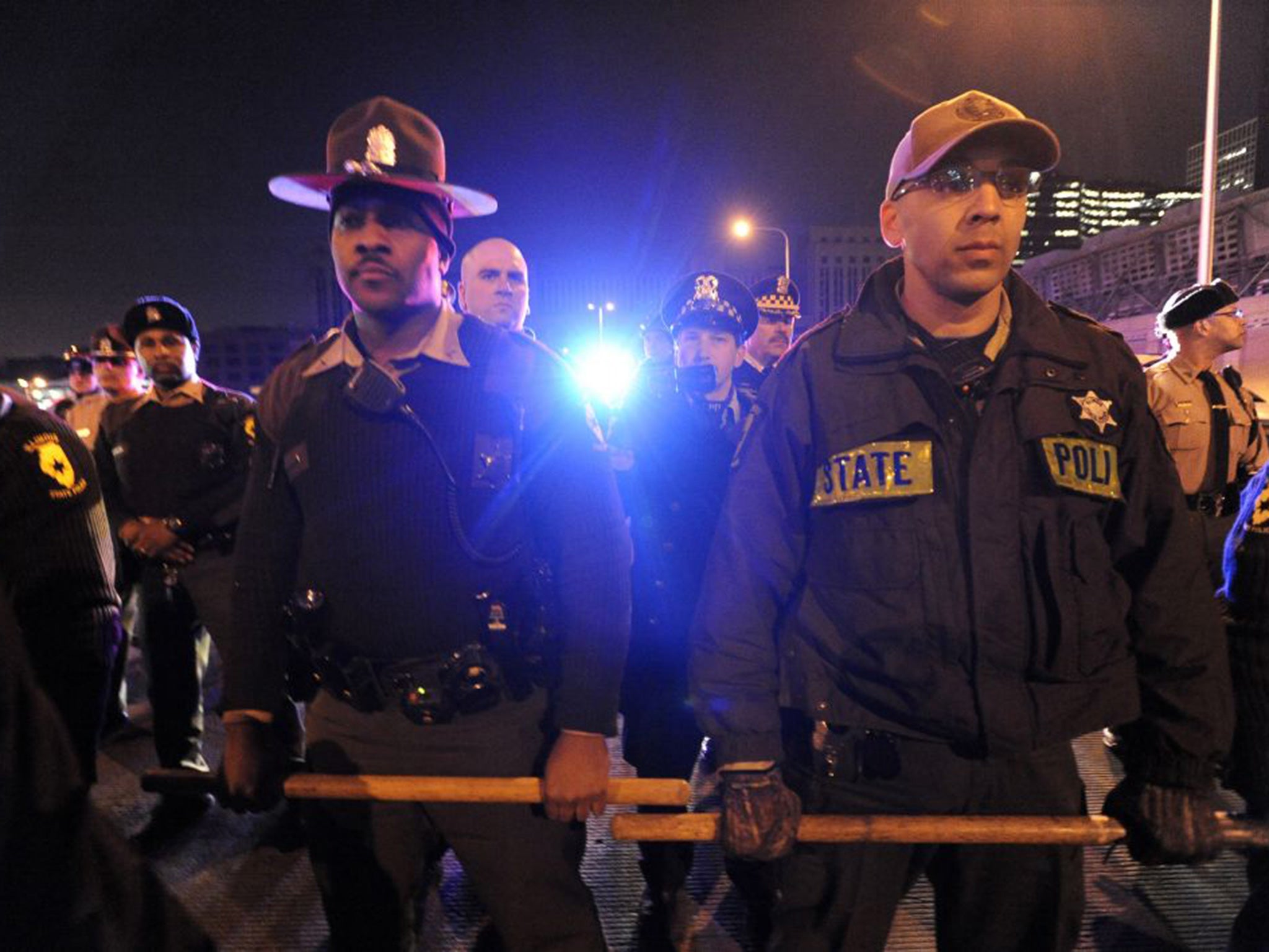 Chicago police form a line to prevent protesters from entering an expressway