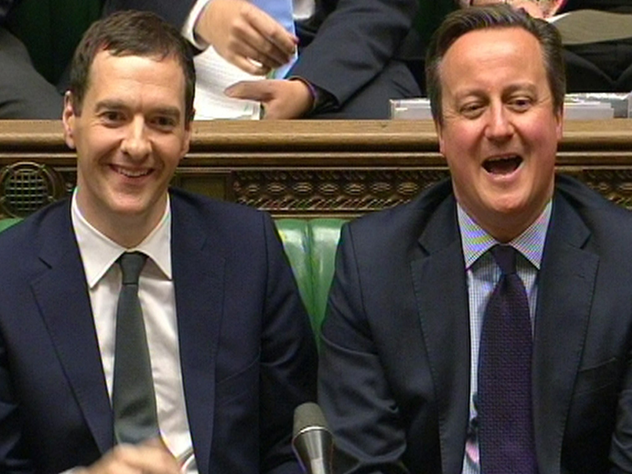 Chancellor of the Exchequer, George Osborne and Prime Minister David Cameron listens as shadow chancellor John McDonnell responds to Osborne after he delivered his joint Autumn Statement and Spending Review to MPs in the House of Commons, London