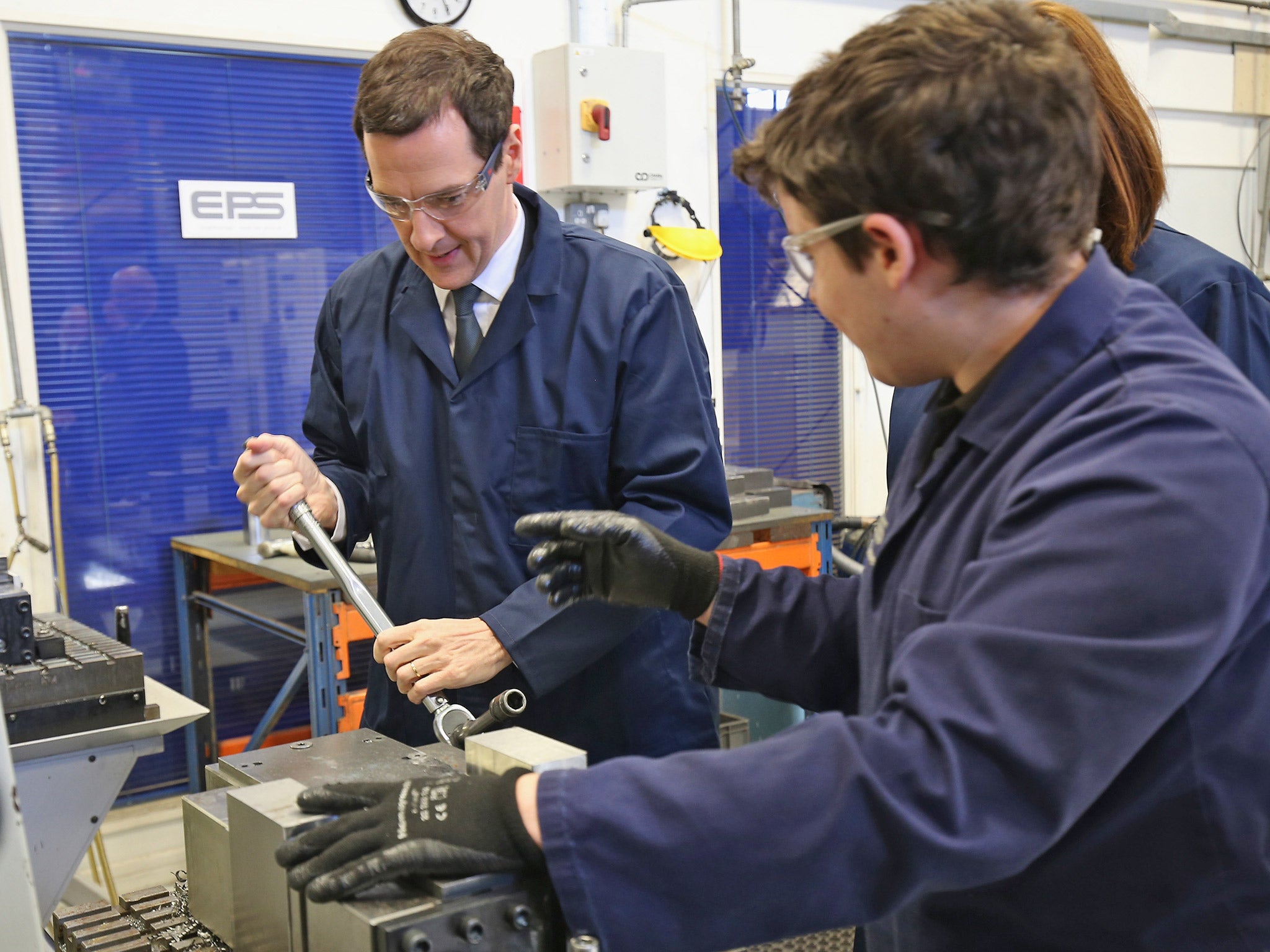 George Osborne receives guidance from an apprentice during a visit to an engineering company earlier this year