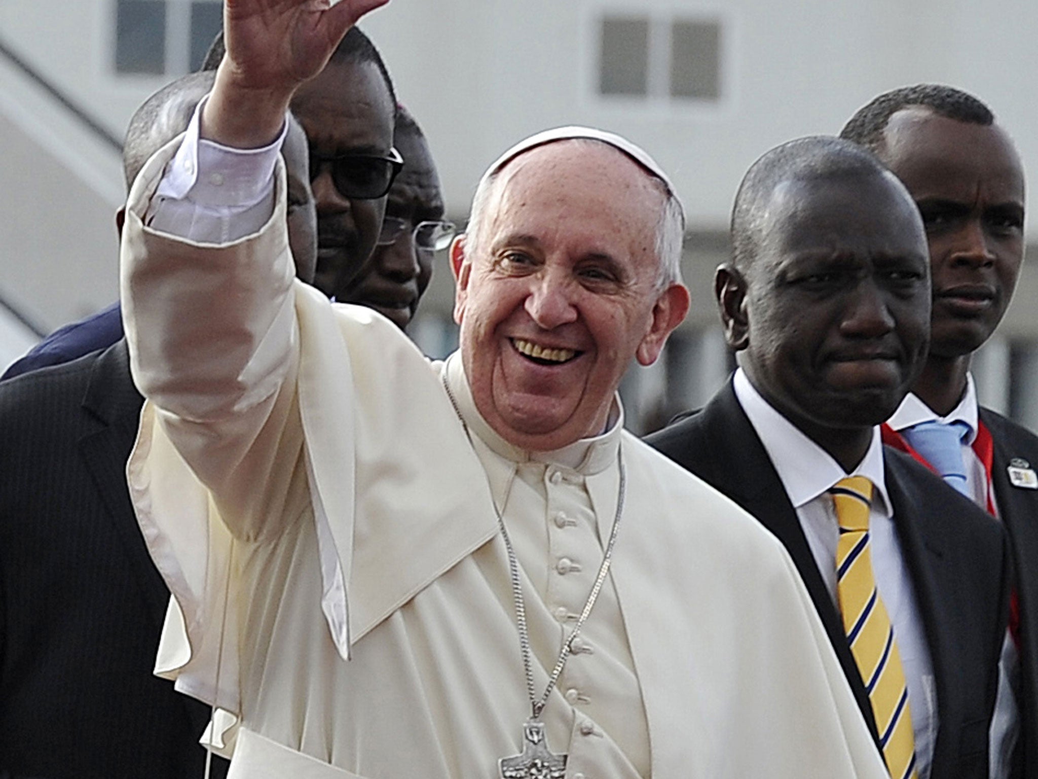 The pope greets the crowds as he touches down in Nairobi