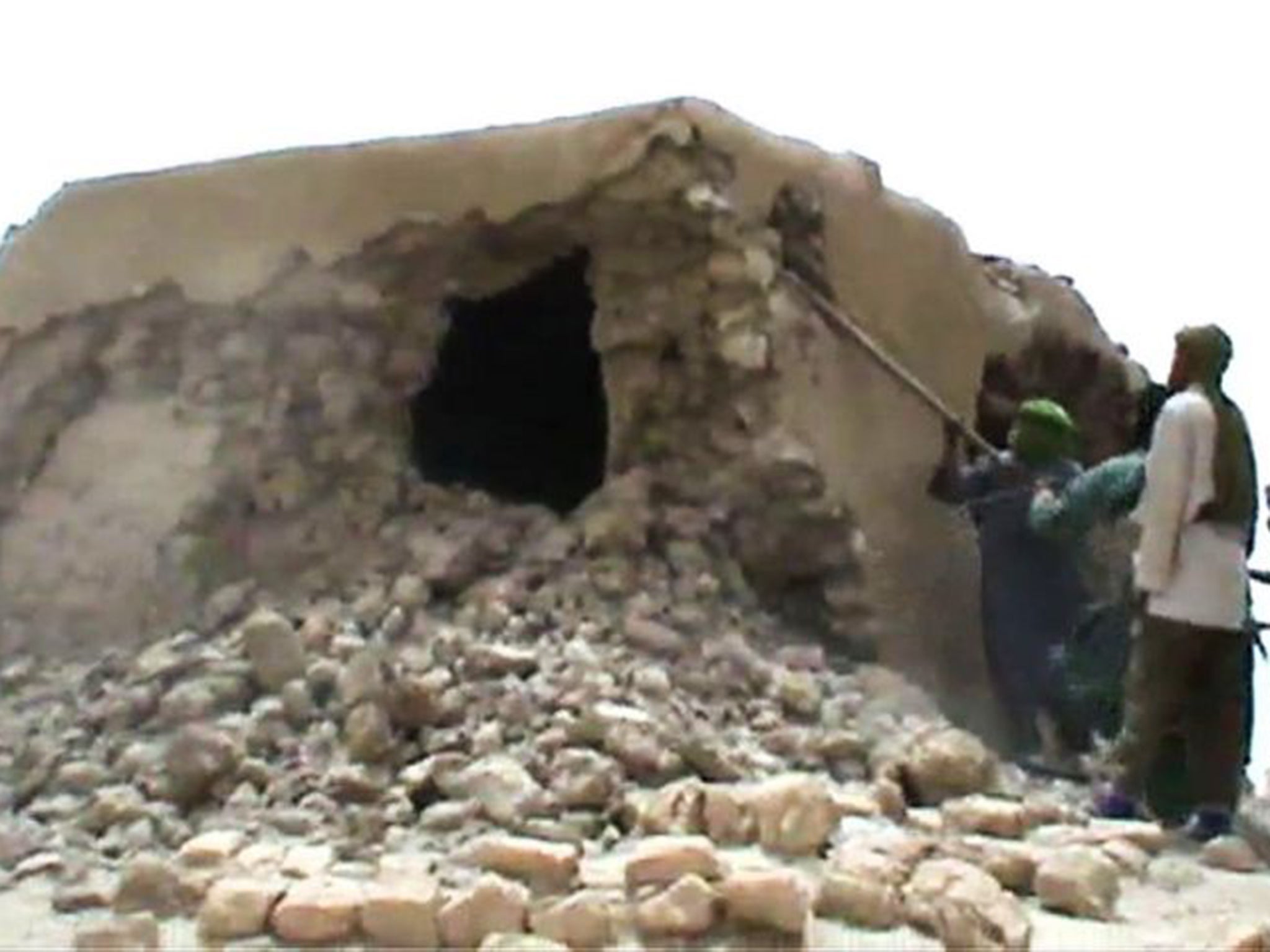 A video still showing Islamist militants destroying an ancient shrine in Timbuktu in 2012