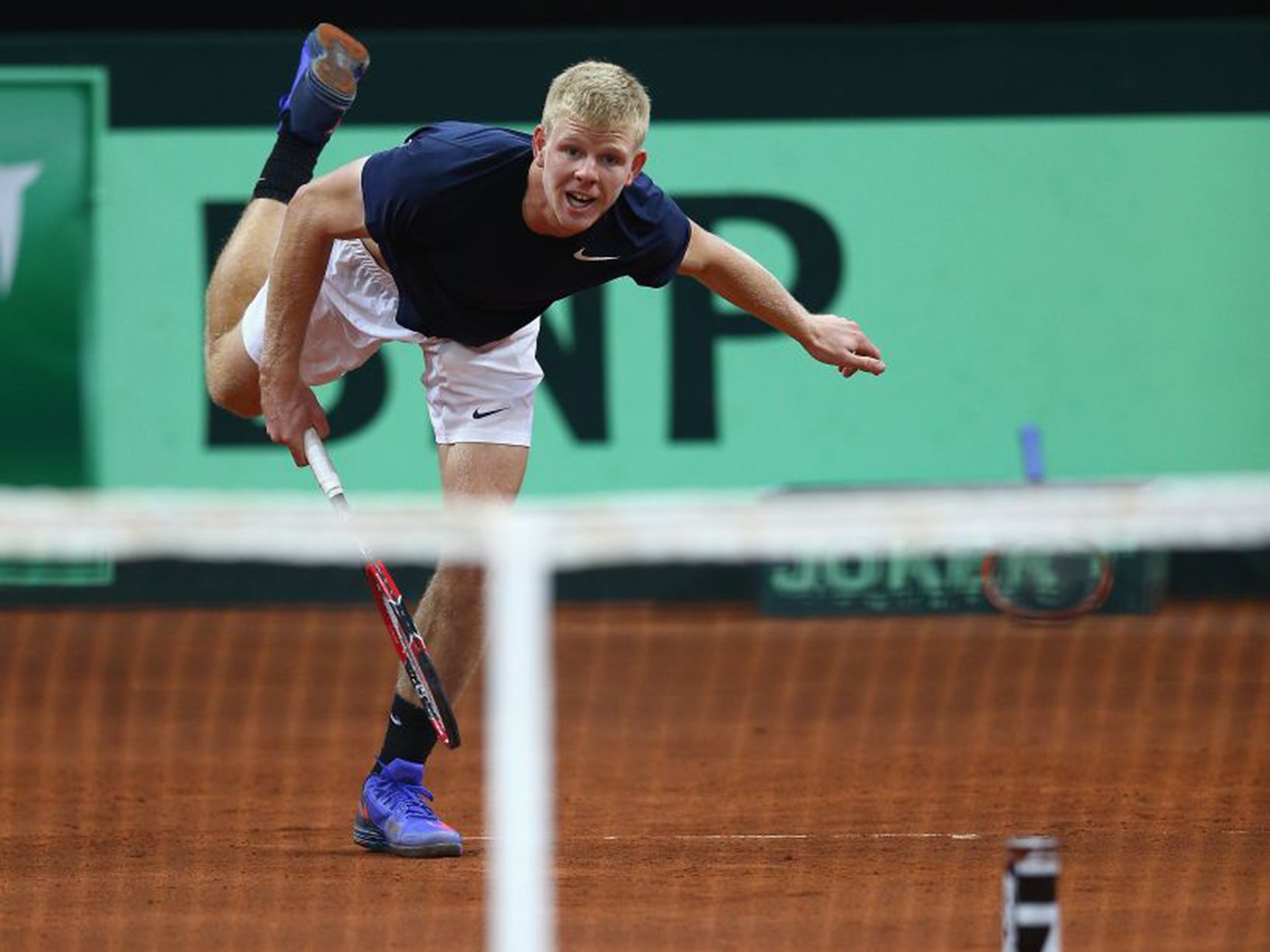 Kyle Edmund serves during practice in Ghent