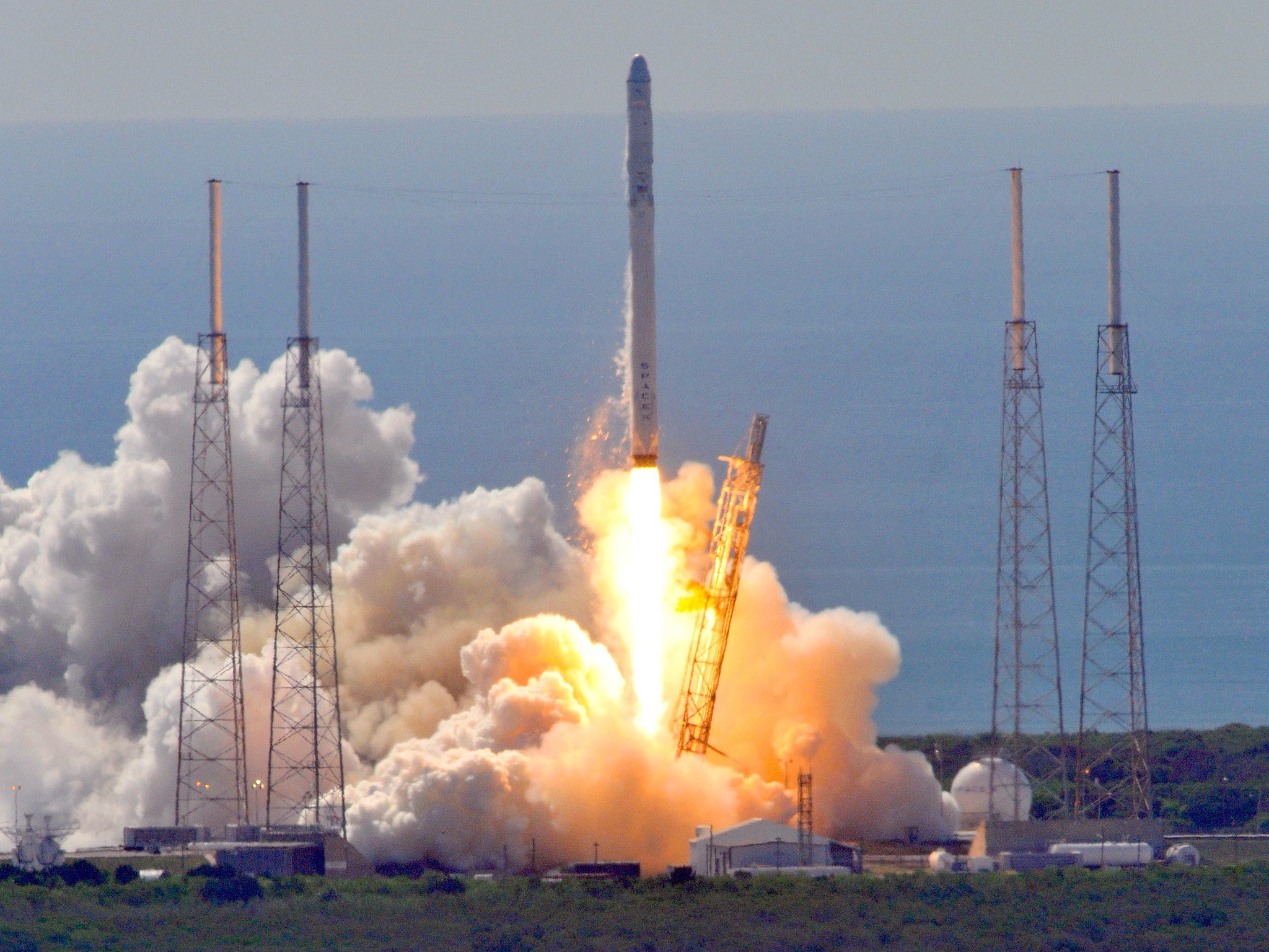 Space X's Falcon 9 rocket lifting off from Cape Canaveral in June