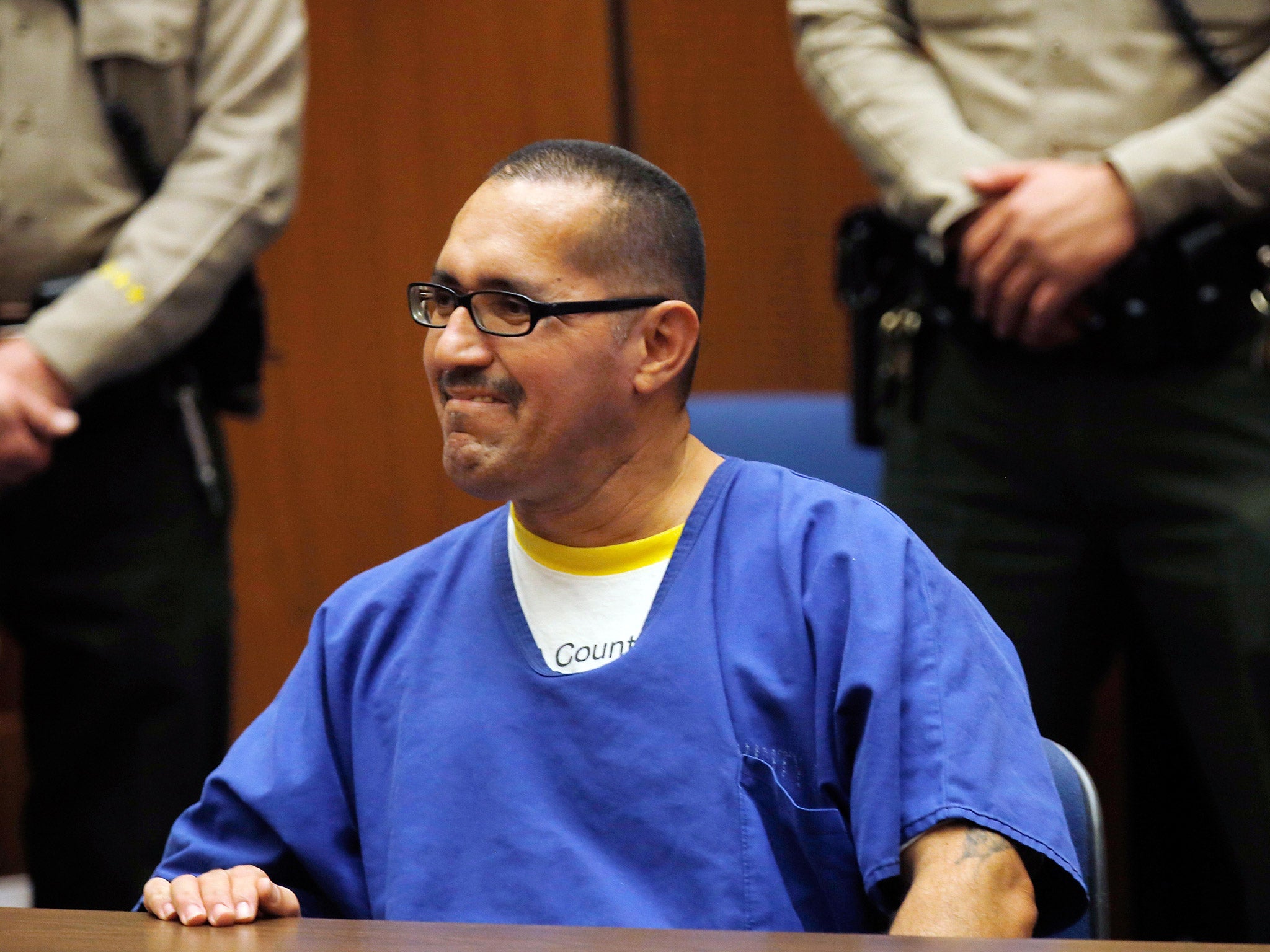 Luis Vargas, who has been in prison for 16 years, reacts in court as he is exonerated