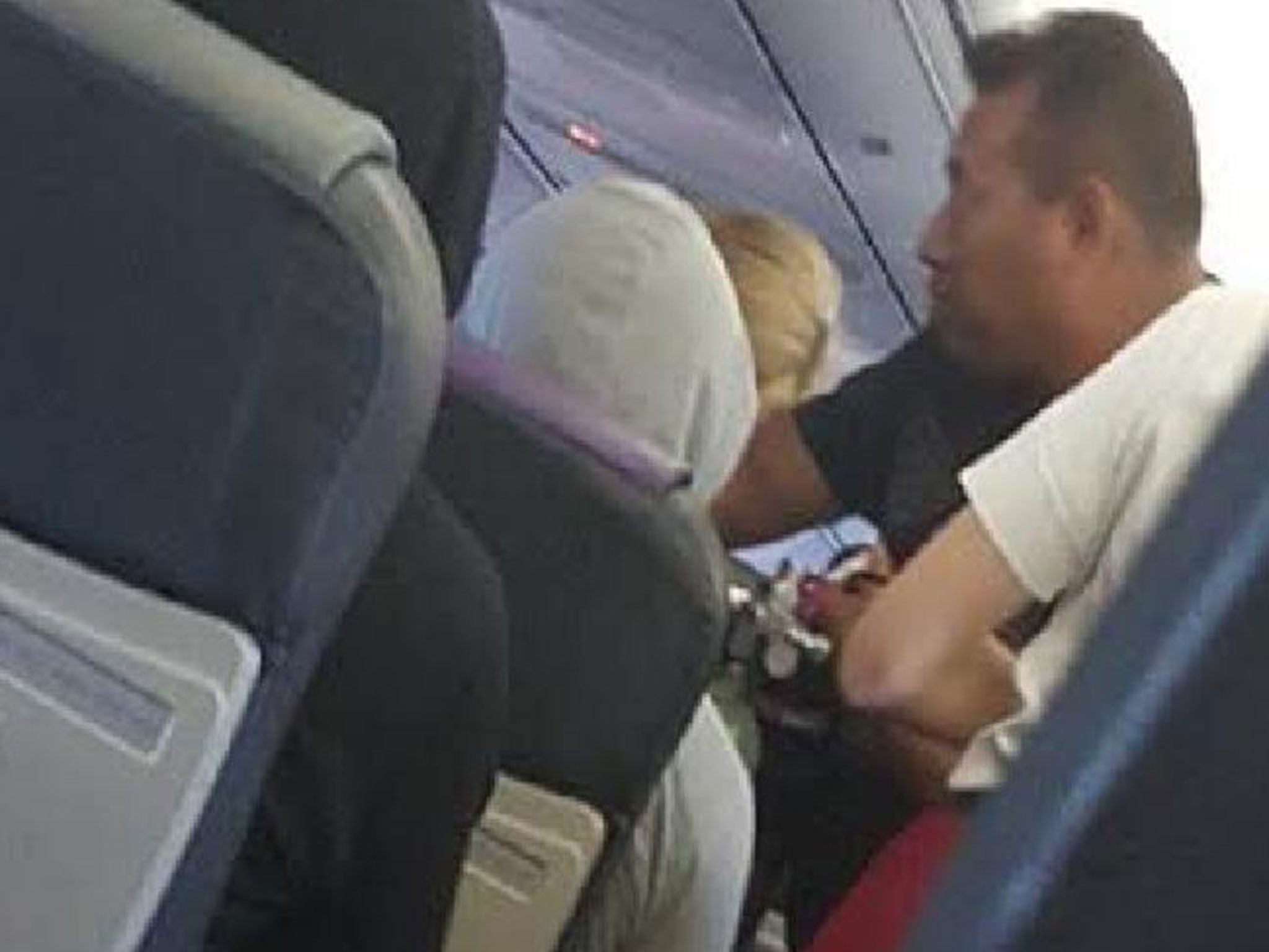 Fijian rugby players serve up lunch during a flight to Brisbane