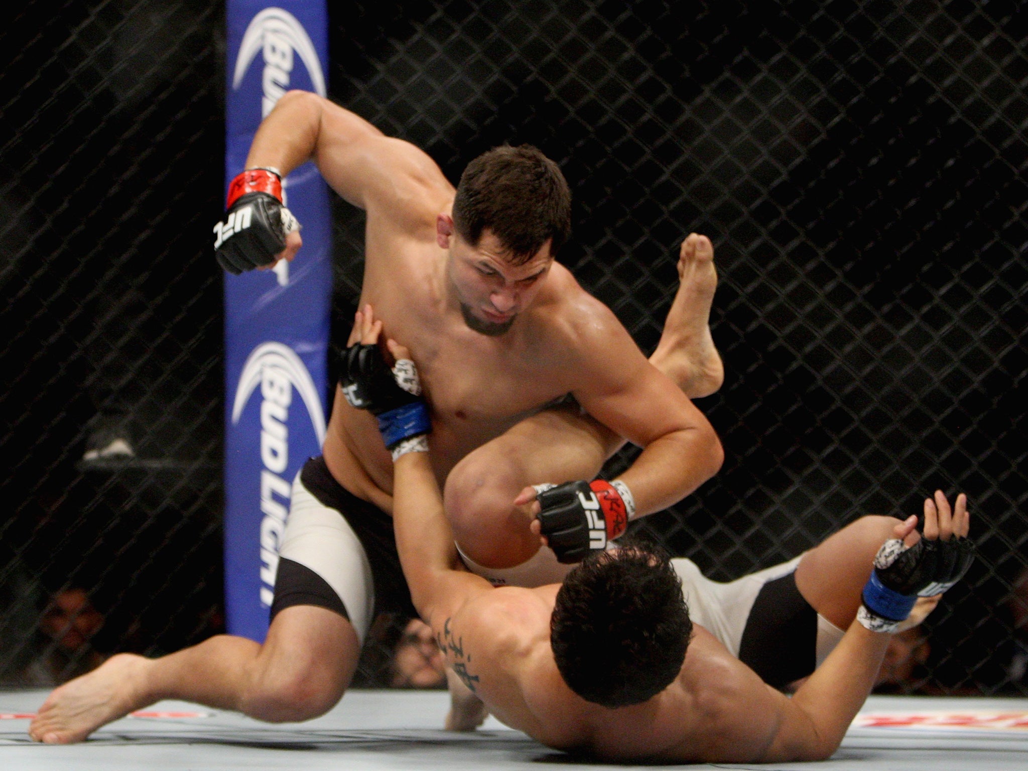 &#13;
Jorge Masvidal (top) punches Cezar Ferreir &#13;