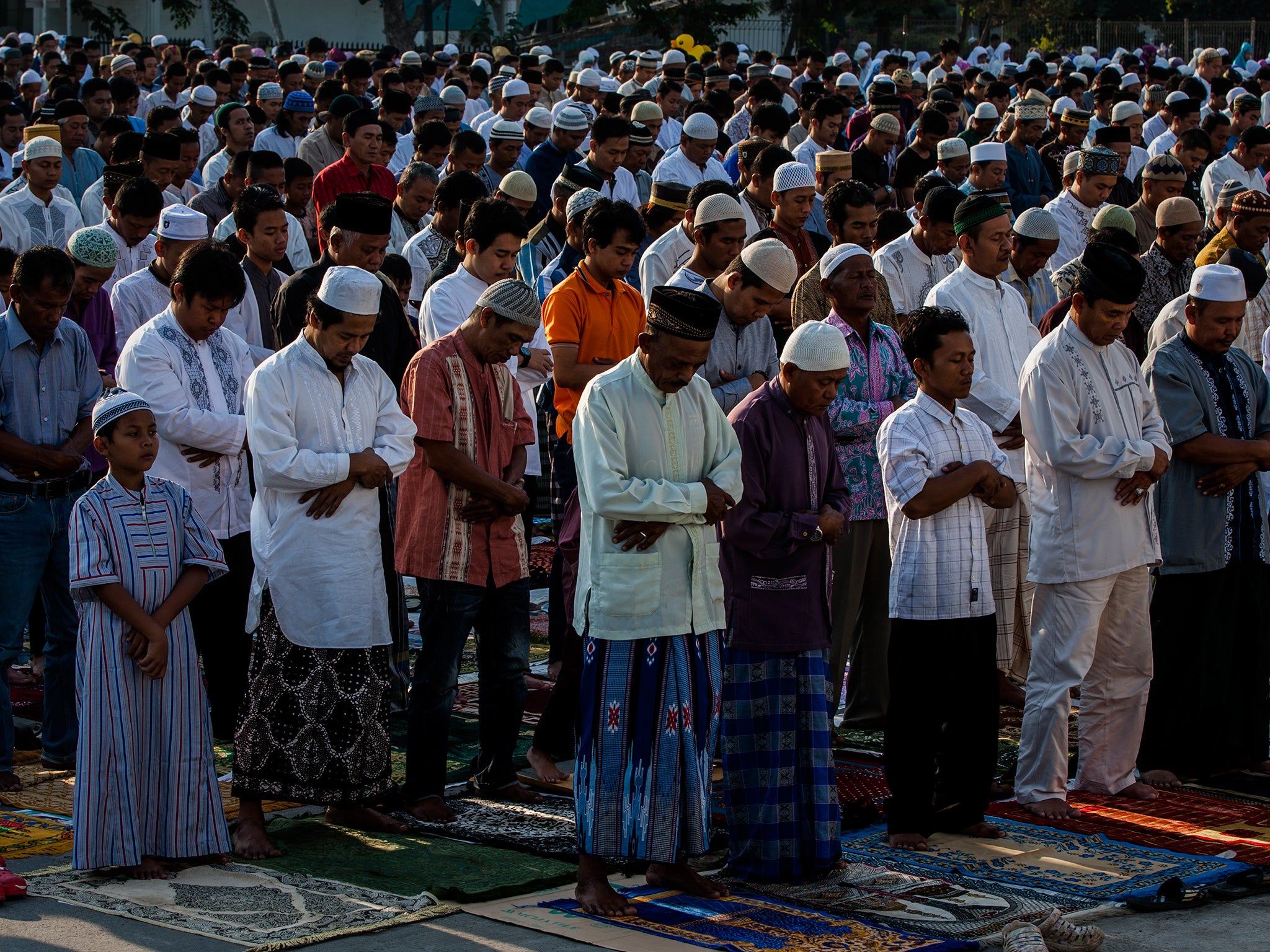 Indonesian Muslims participate in Eid Al-Adha prayers at Sunda Kelapa Port