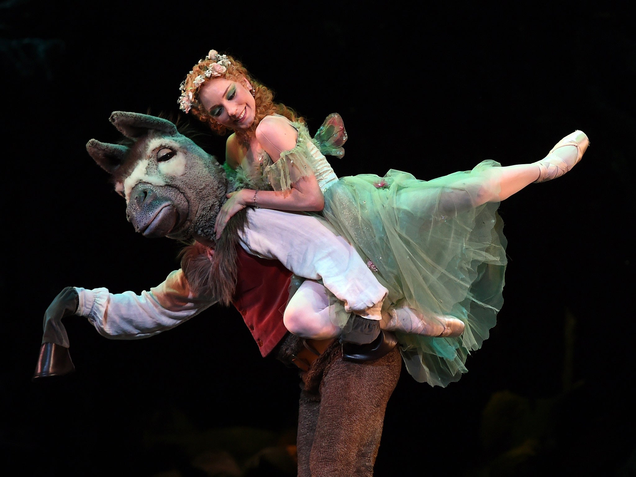 Titania leaps onto Bottom's back in a 2015 performance of A Midsummer Nights Dream in New York