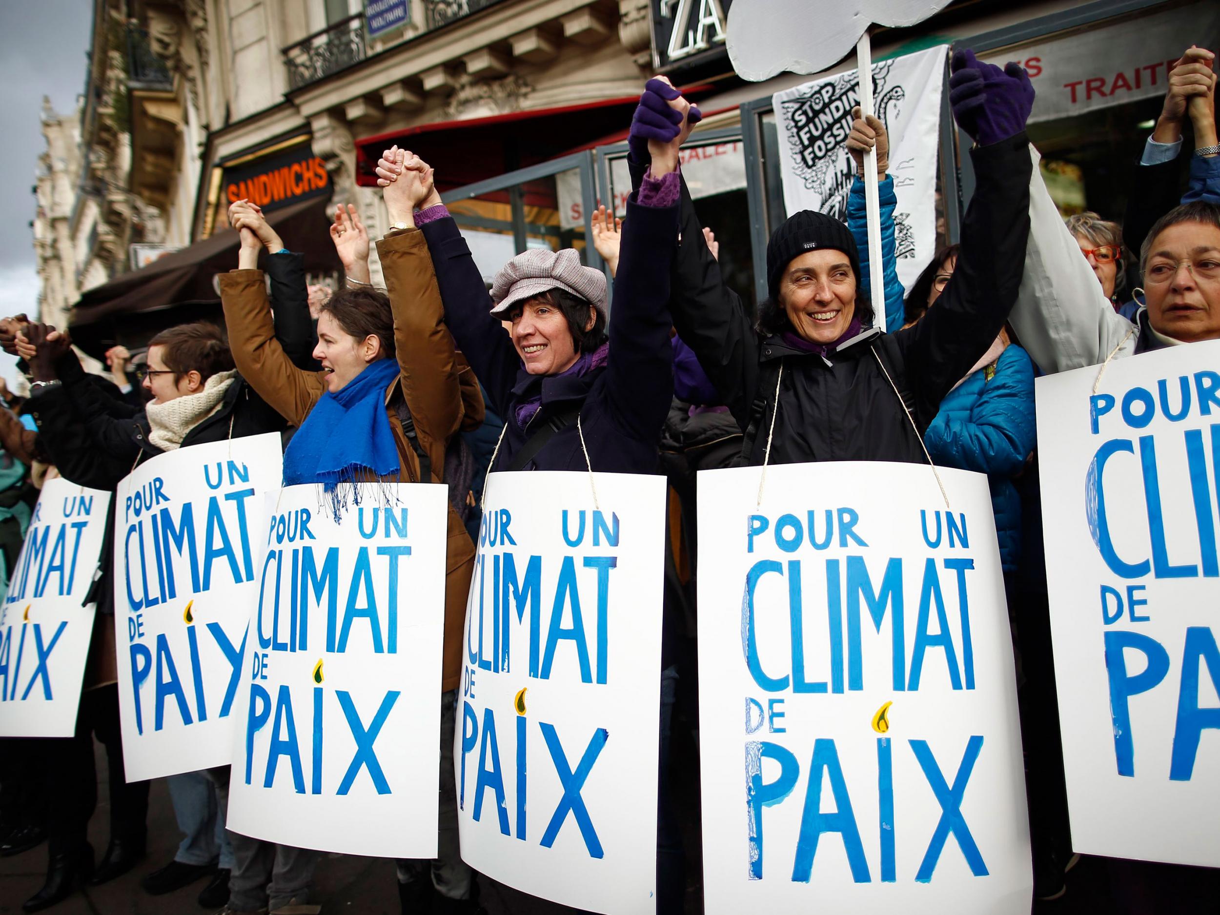 People form a human chain to show solidarity for climate change after the cancellation of the planned climate march