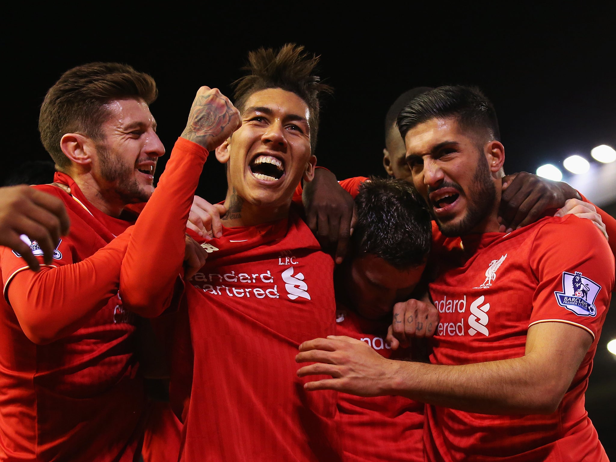 Liverpool's players congratulate James Milner on opening the scoring