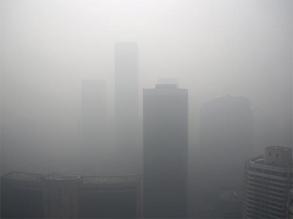 High-rise buildings are seen during a heavily polluted day in Beijing