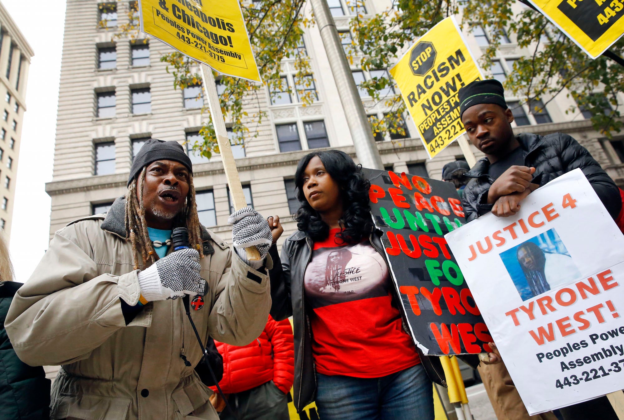 Protestors gather outside the Clarence M Mitchell Jr Courthouse n Baltimore on Monday. Patrick Semansky/Associated Press