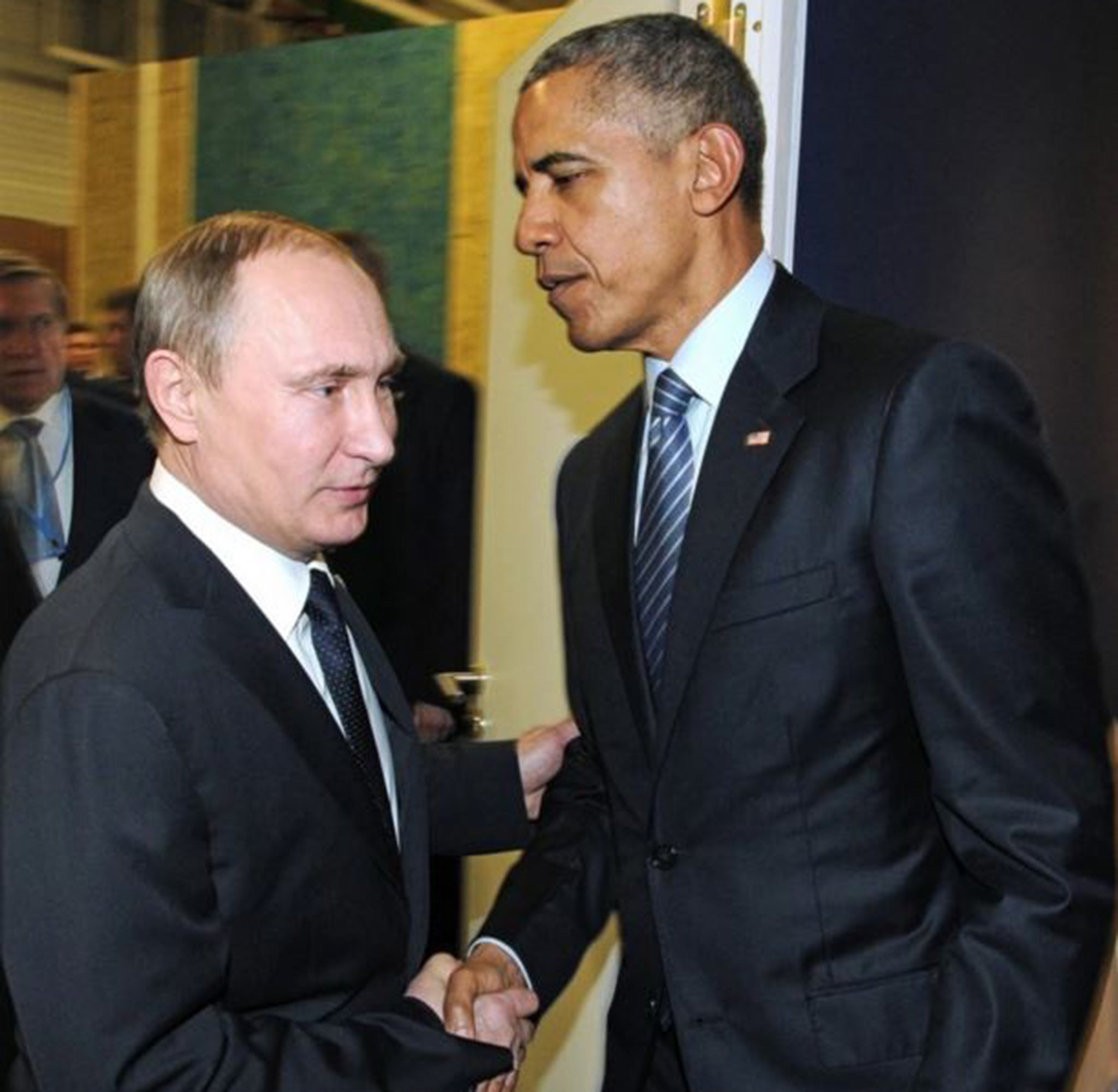 President Obama and Russian President Vladimir Putin shake hands at the U.N. Conference on Climate Change in Paris on Nov. 30