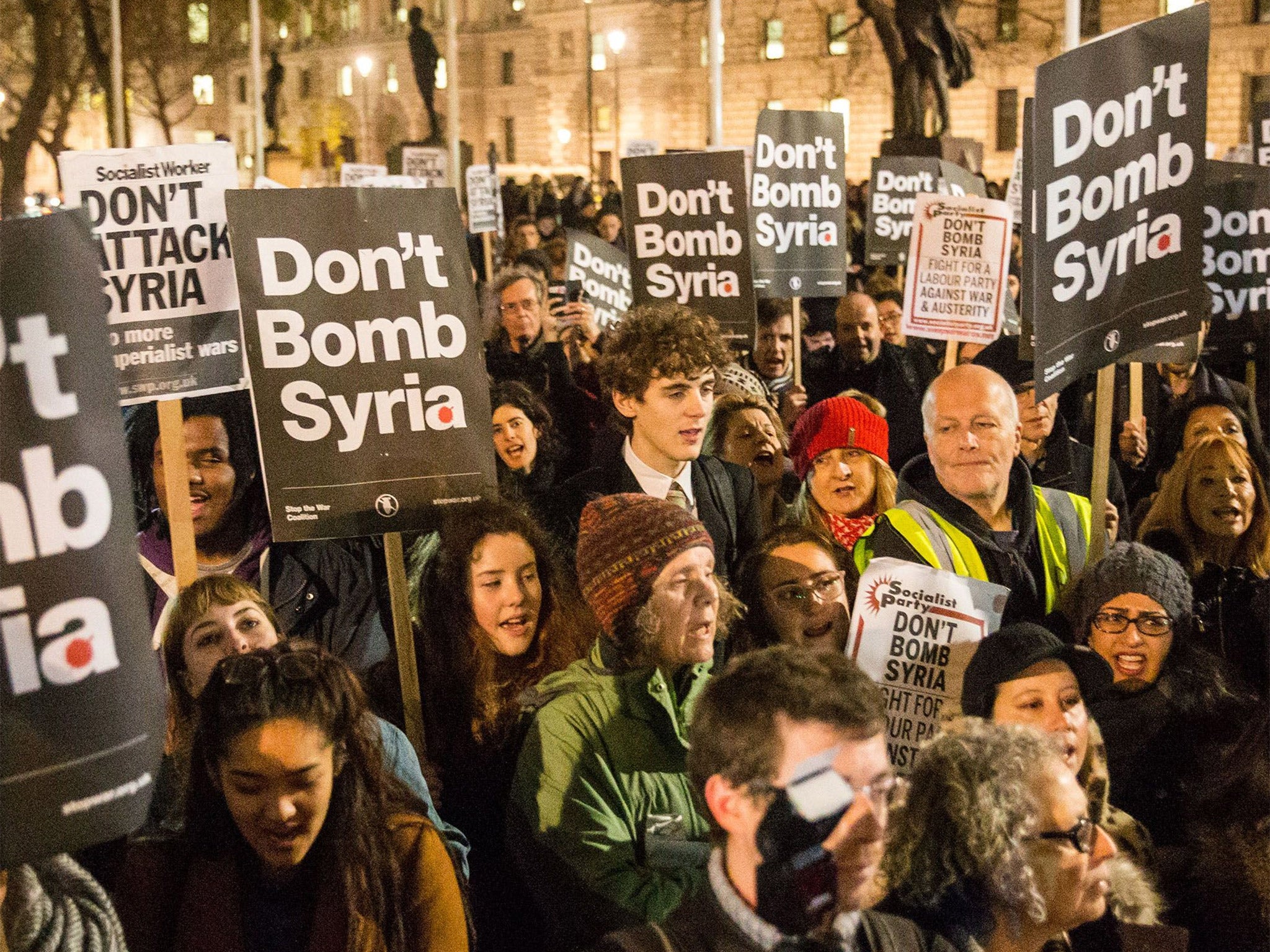 'Stop the War' supporters protest against plans to extend British air strikes against Isis from Iraq into Syria, in Parliament Square, London (Rex)