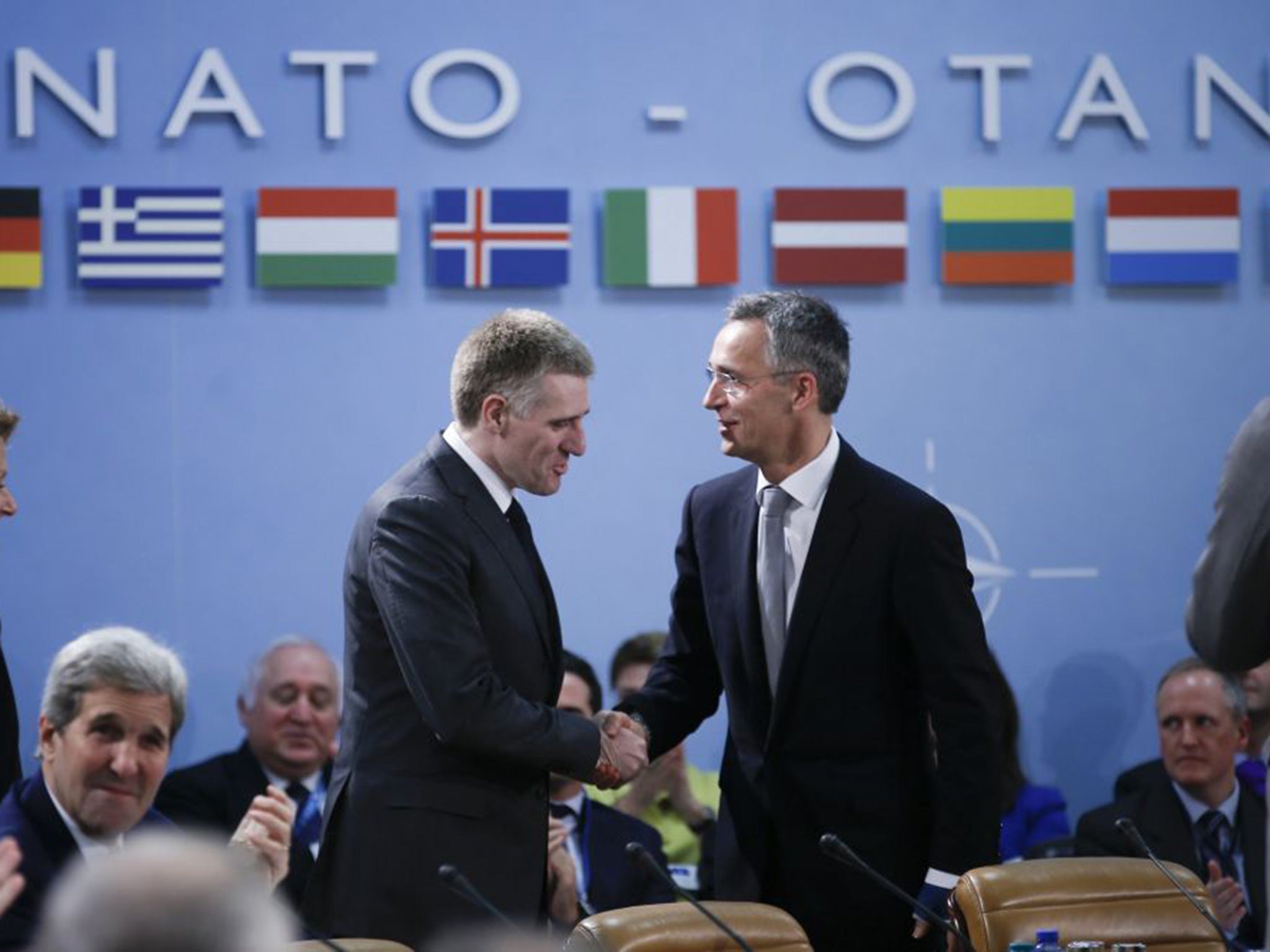 Montenegro's Deputy Prime Minister Igor Luksic (C-L) and NATO Secretary General Jens Stoltenberg