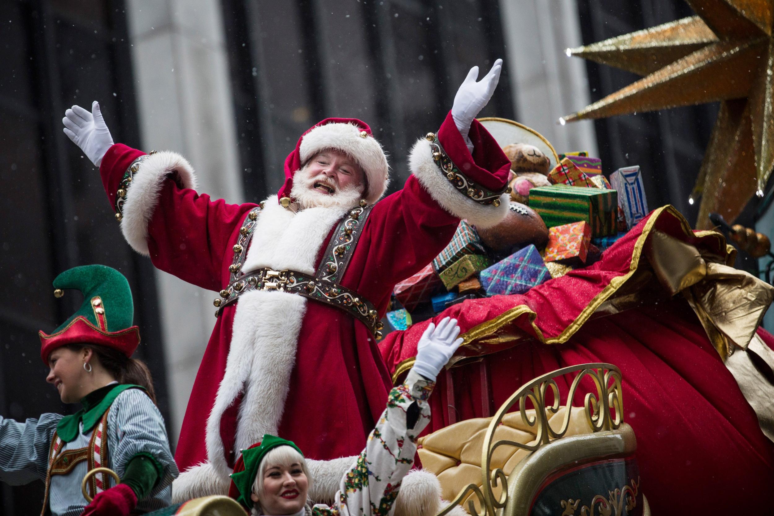 Santa Claus waves to the crowd during the Macy's Thanksgiving Day Parade in New York