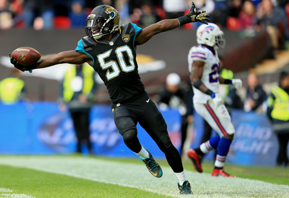 &#13;
Telvin Smith celebrates scoring a touchdown during the win over the Bills at Wembley&#13;