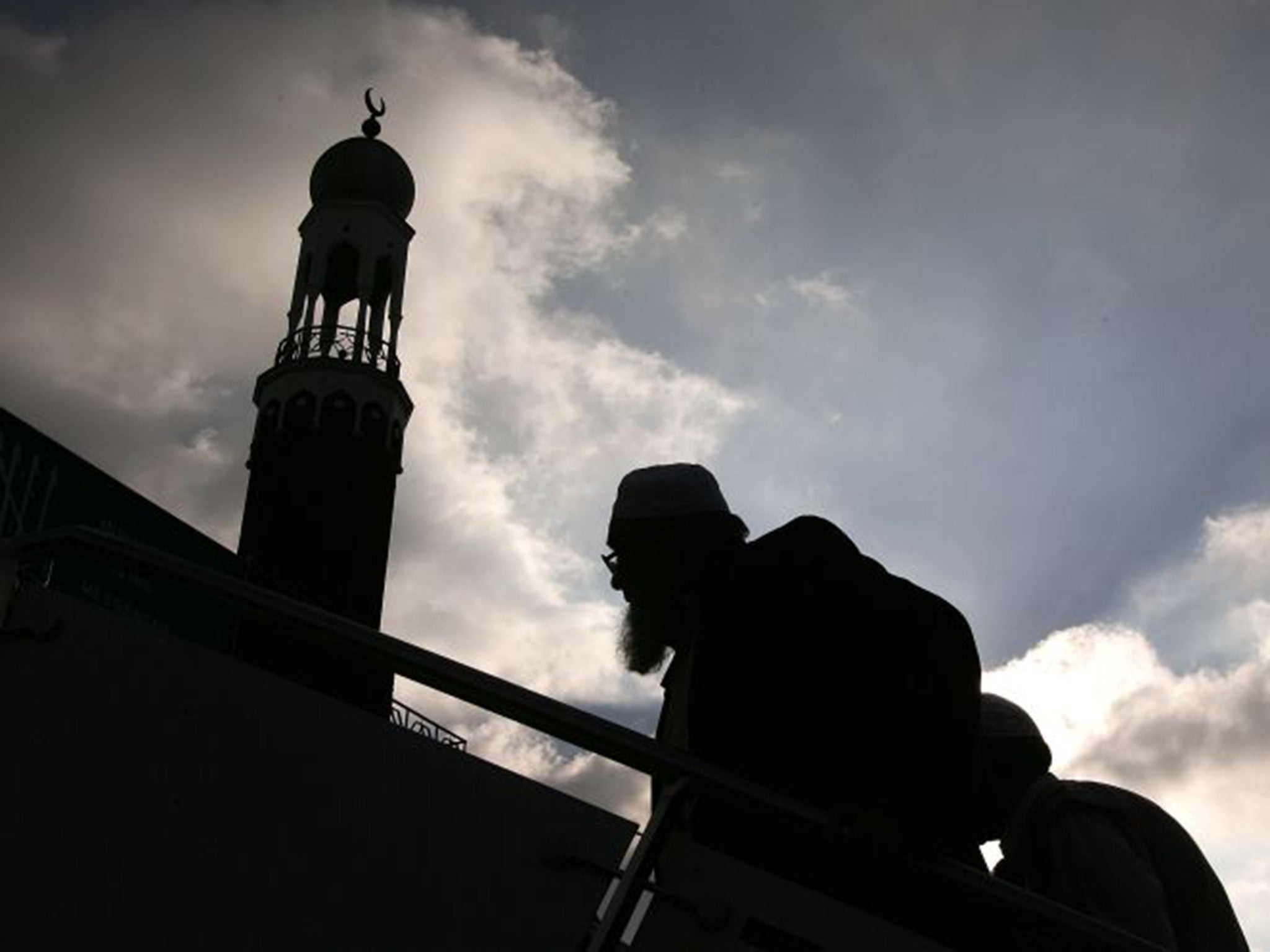 Muslims arrive for Friday prayers at Birmingham Central Mosque, where one of Britain’s sharia courts is located