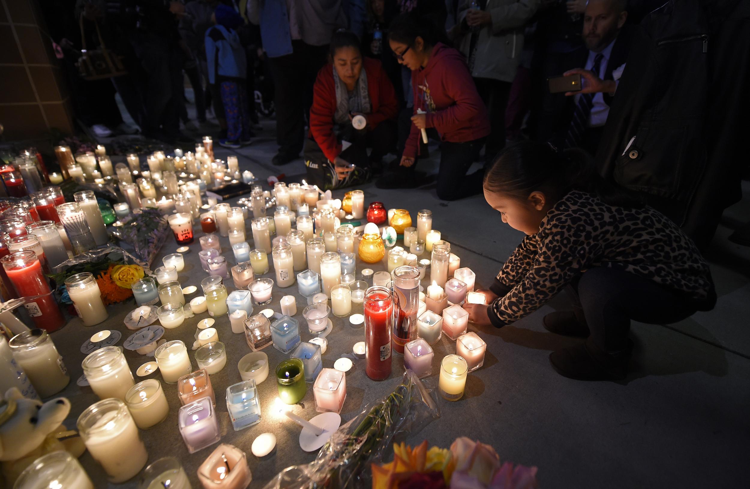 People attend a candle-lit vigil in San Bernardino, California. Mark J Terrill/Associated Press