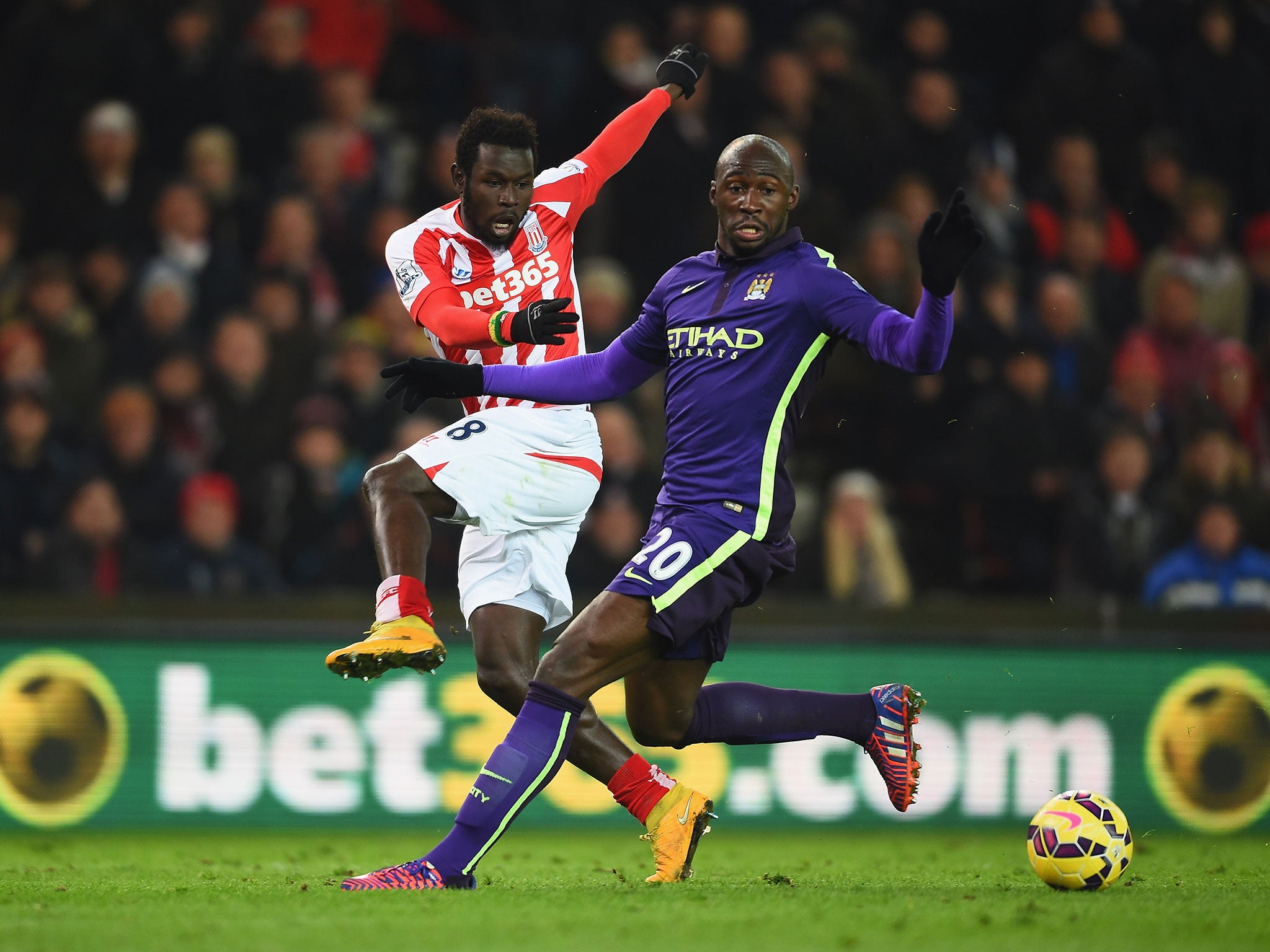 Mame Biram Diouf jostles with Eliaquim Mangala