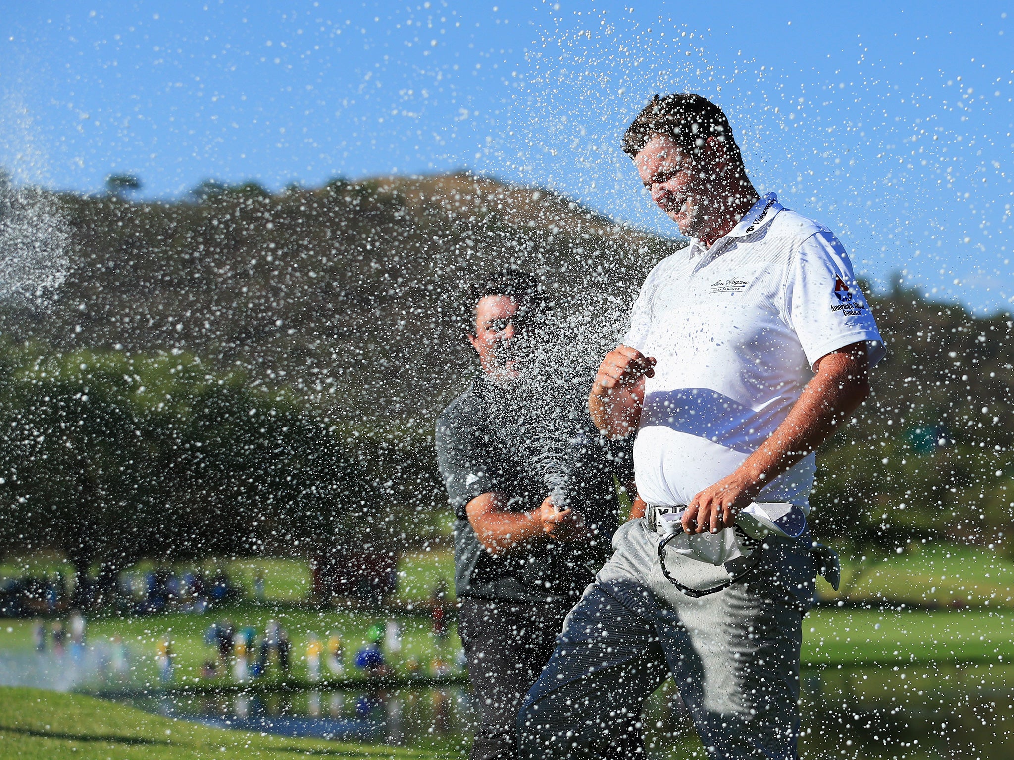 Marc Leishman is sprayed with champagne after winning the Nedbank Golf Challenge by six shots