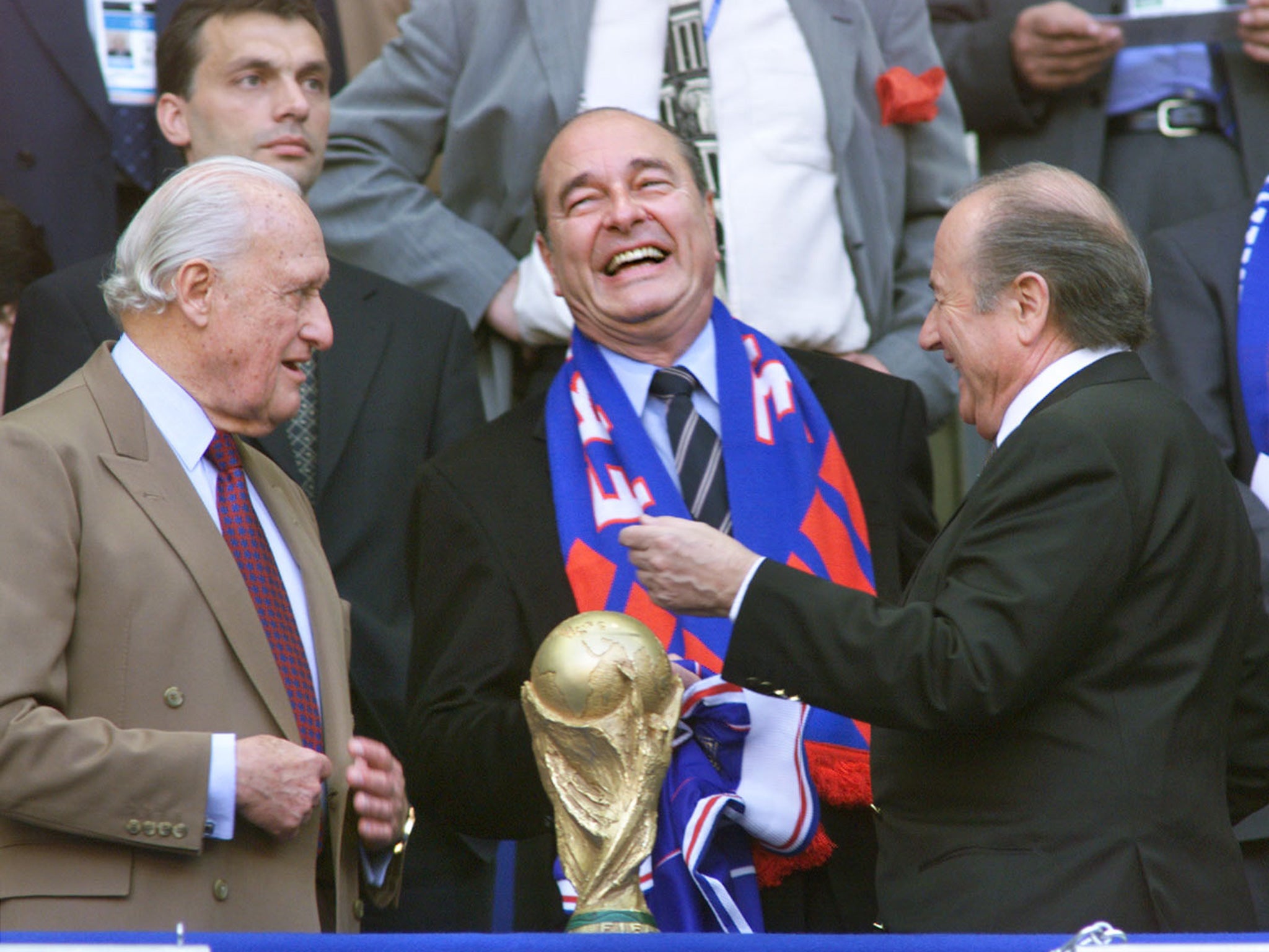 Jacques Chirac, centre, the French President at the time, shares a joke with the current and former Fifa presidents Sepp Blatter and Joao Havelange, left, in the Stade de France in Paris, before the 1998 World Cup final between Brazil and France