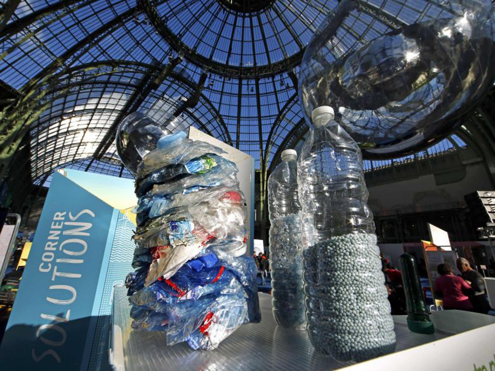 Recycled plastic bottles pictured at the Grand Palais during the Solutions COP21 in Paris, France. Global leaders have until Friday night to finalise a strong deal on combating climate change