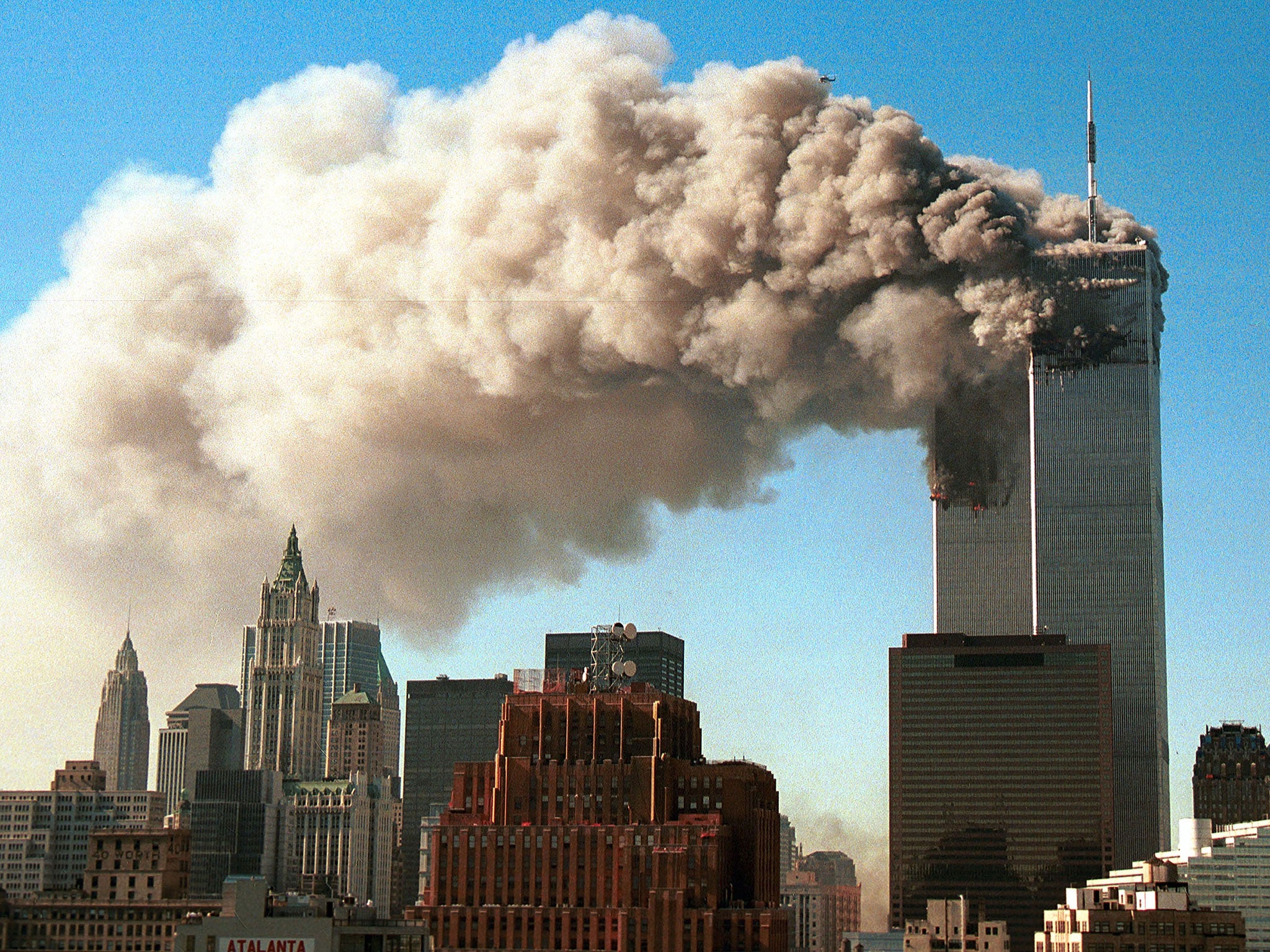 Smoke pours from the twin towers of the World Trade Centre after they were hit by two hijacked airliners in a terrorist attack 11 September, 2011