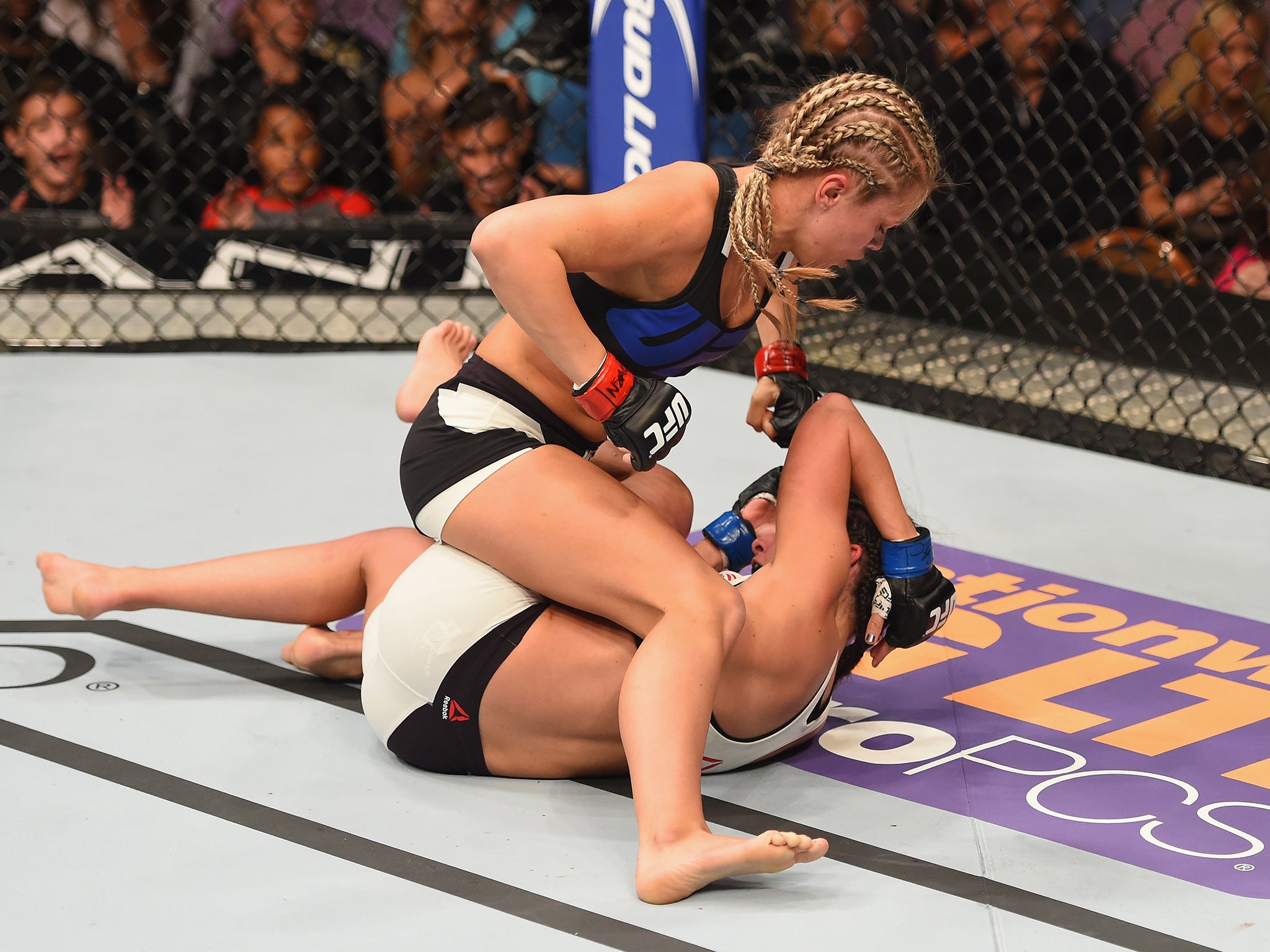 Paige VanZant (top) punches Alex Chambers