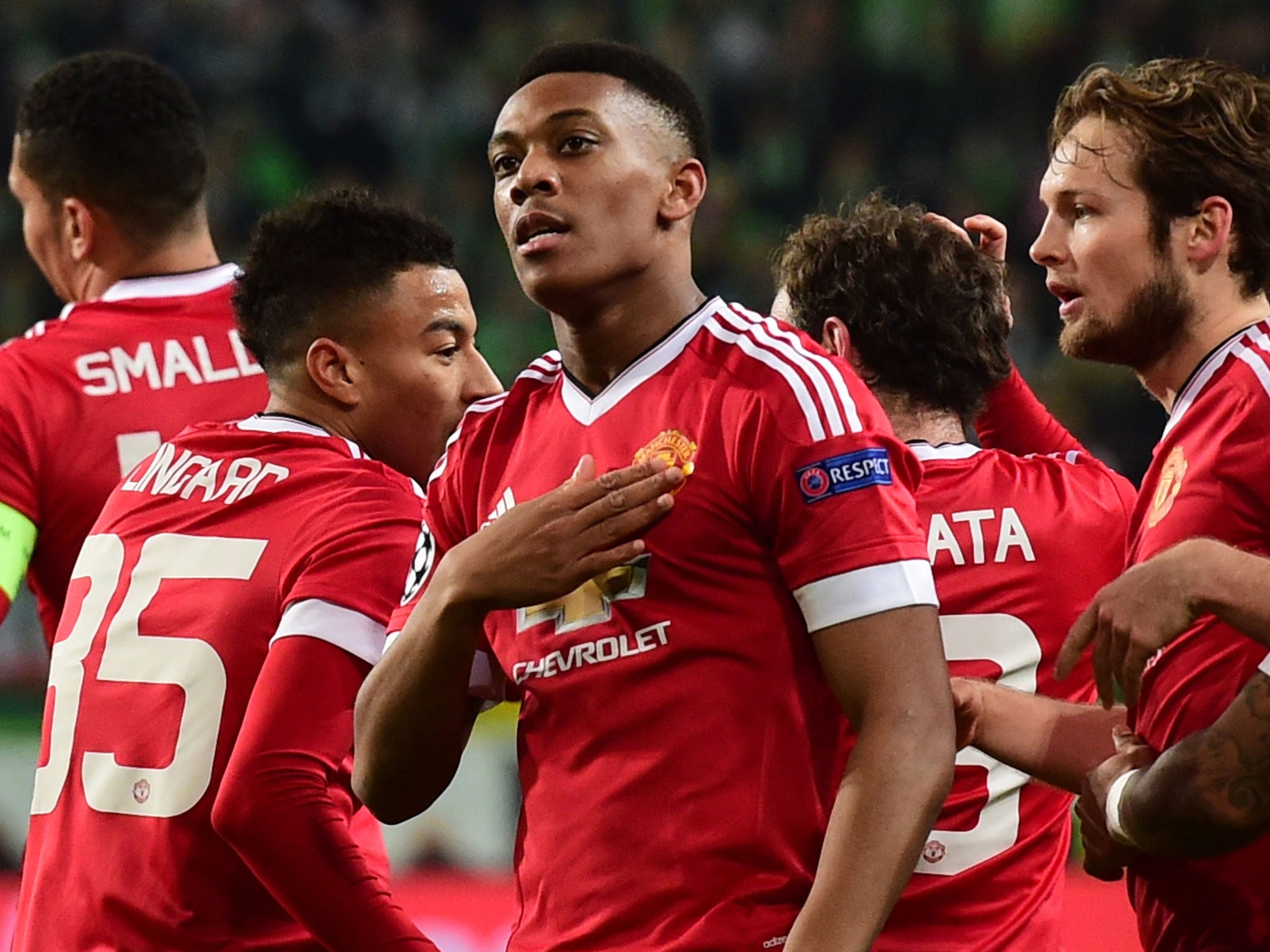 Anthony Martial celebrates opening the scoring against Wolfsburg